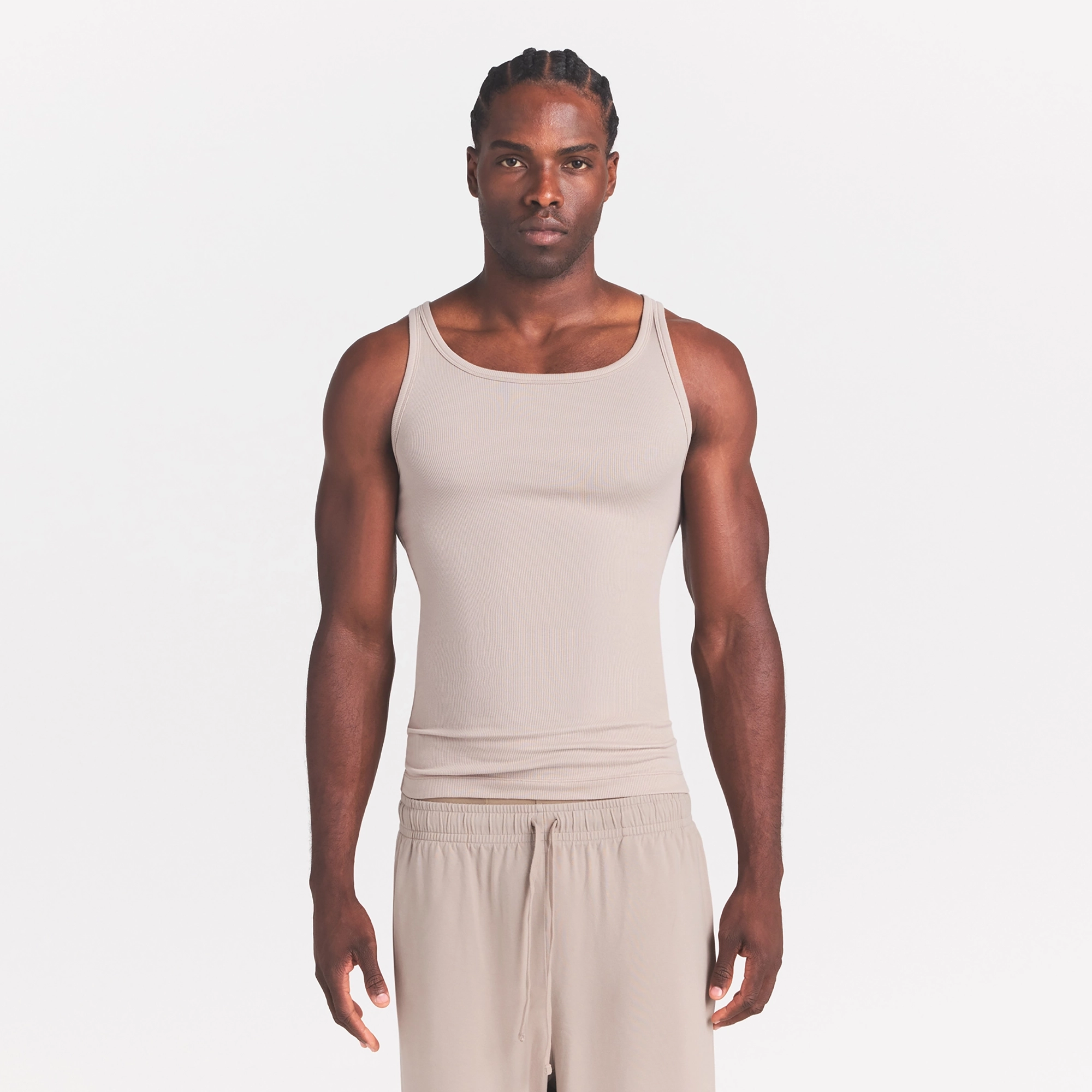 SKIMS COTTON RIB MENS TANK 3-PACK | LINEN ECRU MULTI ON A MODEL SIDE VIEW @ | FOCUS: 0.0, 1.0, 0.9