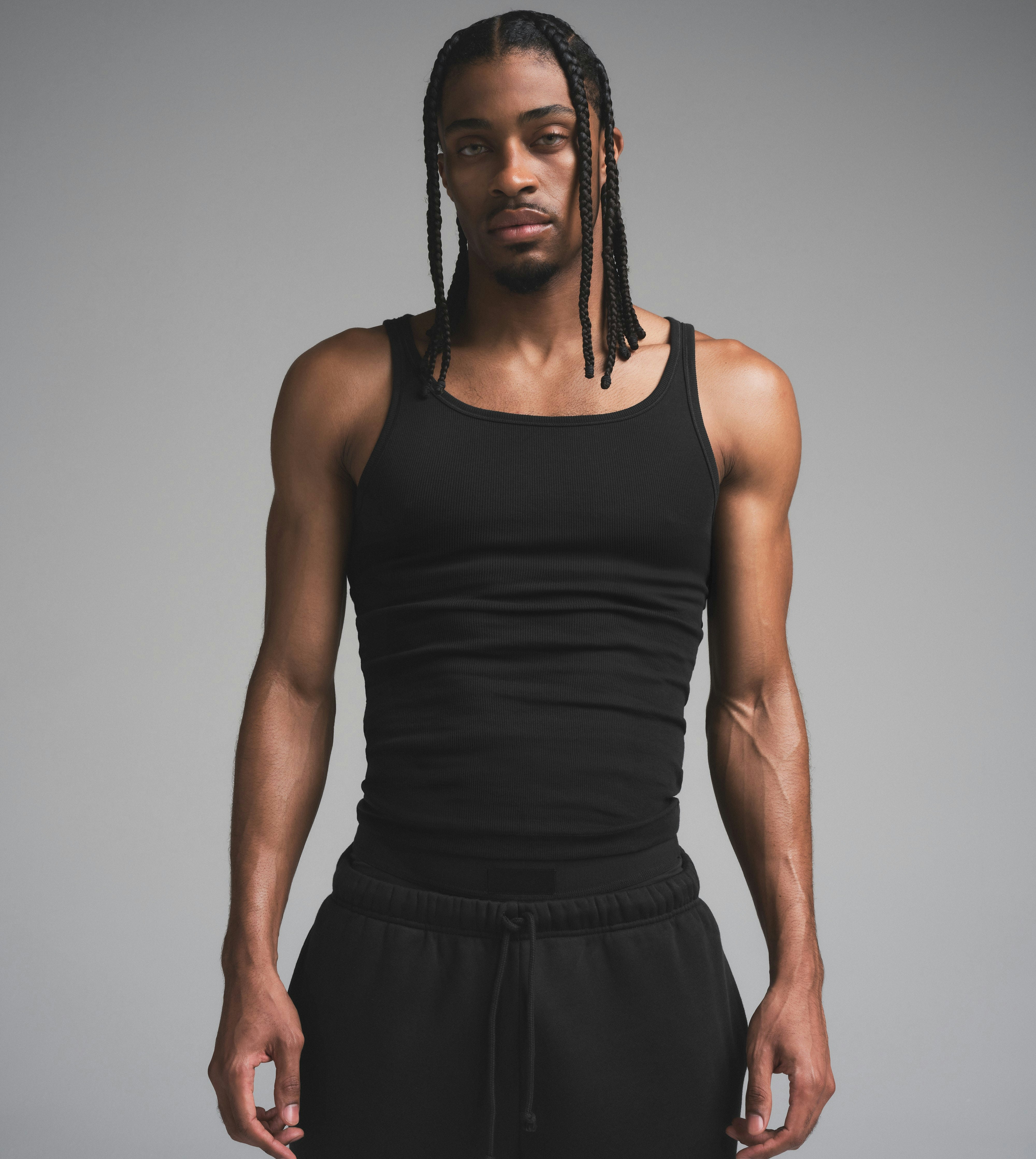 SKIMS COTTON MENS RIB TANK 3-PACK | ONYX ON A MODEL SIDE VIEW | FOCUS: 0.0, 1.0, 0.9