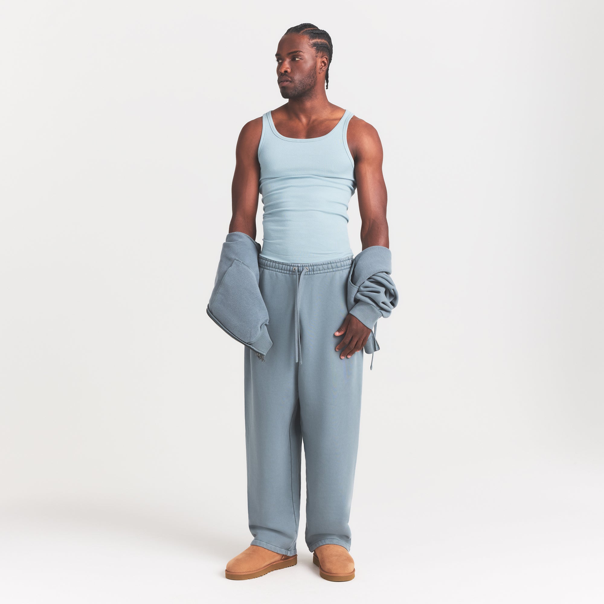 SKIMS COTTON MENS RIB TANK 3-PACK | VERDANT DARK SEPIA MULTI ON A MODEL FRONT VIEW @ | FOCUS: 0.0, 1.0, 0.9