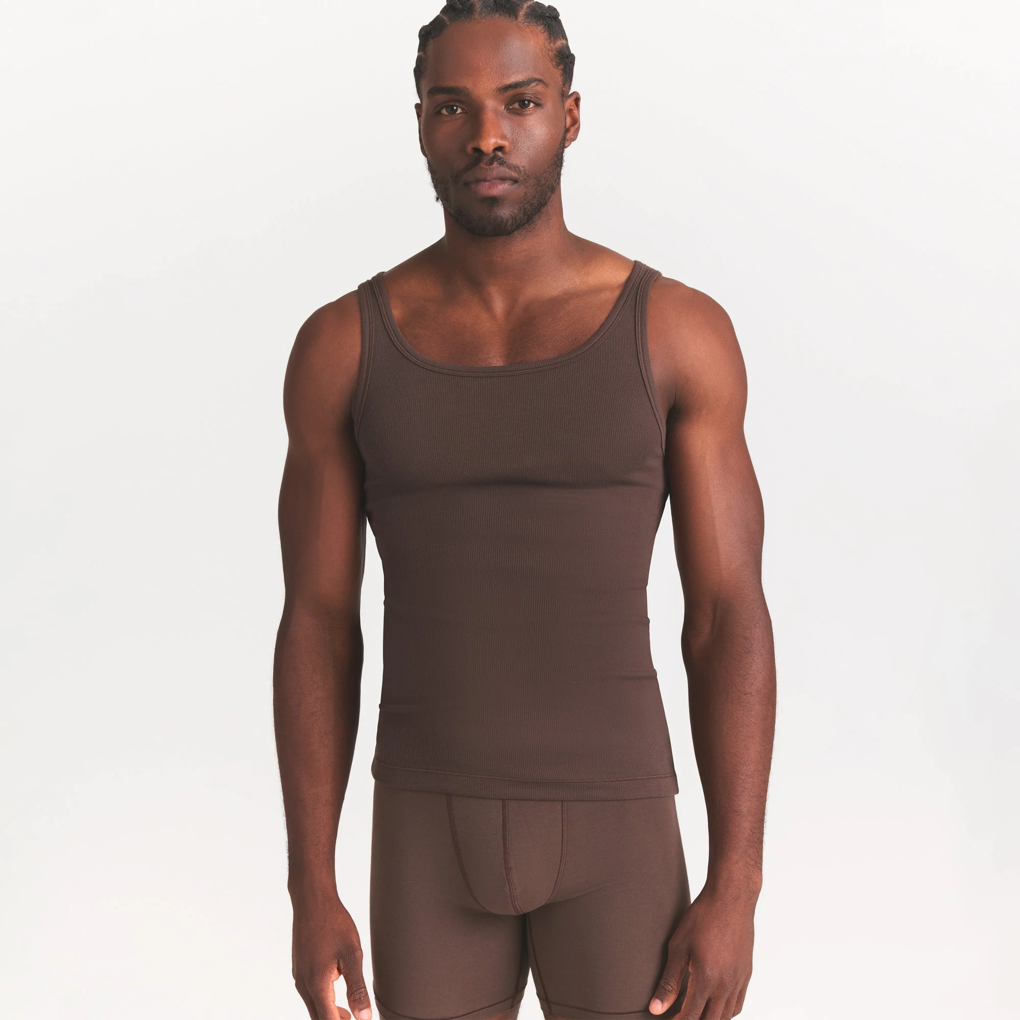 SKIMS COTTON MENS RIB TANK 3-PACK | VERDANT DARK SEPIA MULTI ON A MODEL SIDE VIEW @ | FOCUS: 0.0, 1.0, 0.9