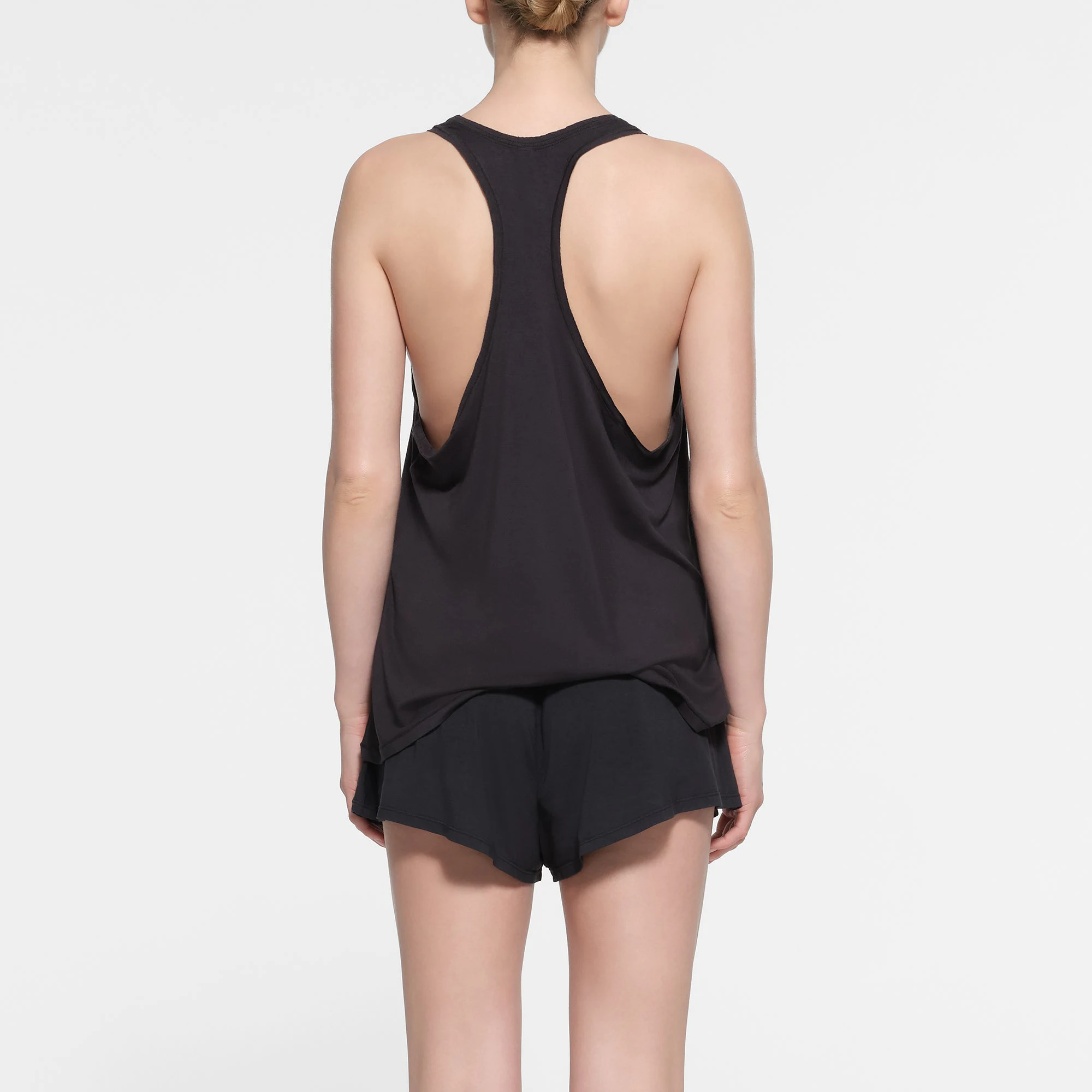 SKIMS SLEEP LOOSE TANK | ONYX ON A MODEL BACK VIEW