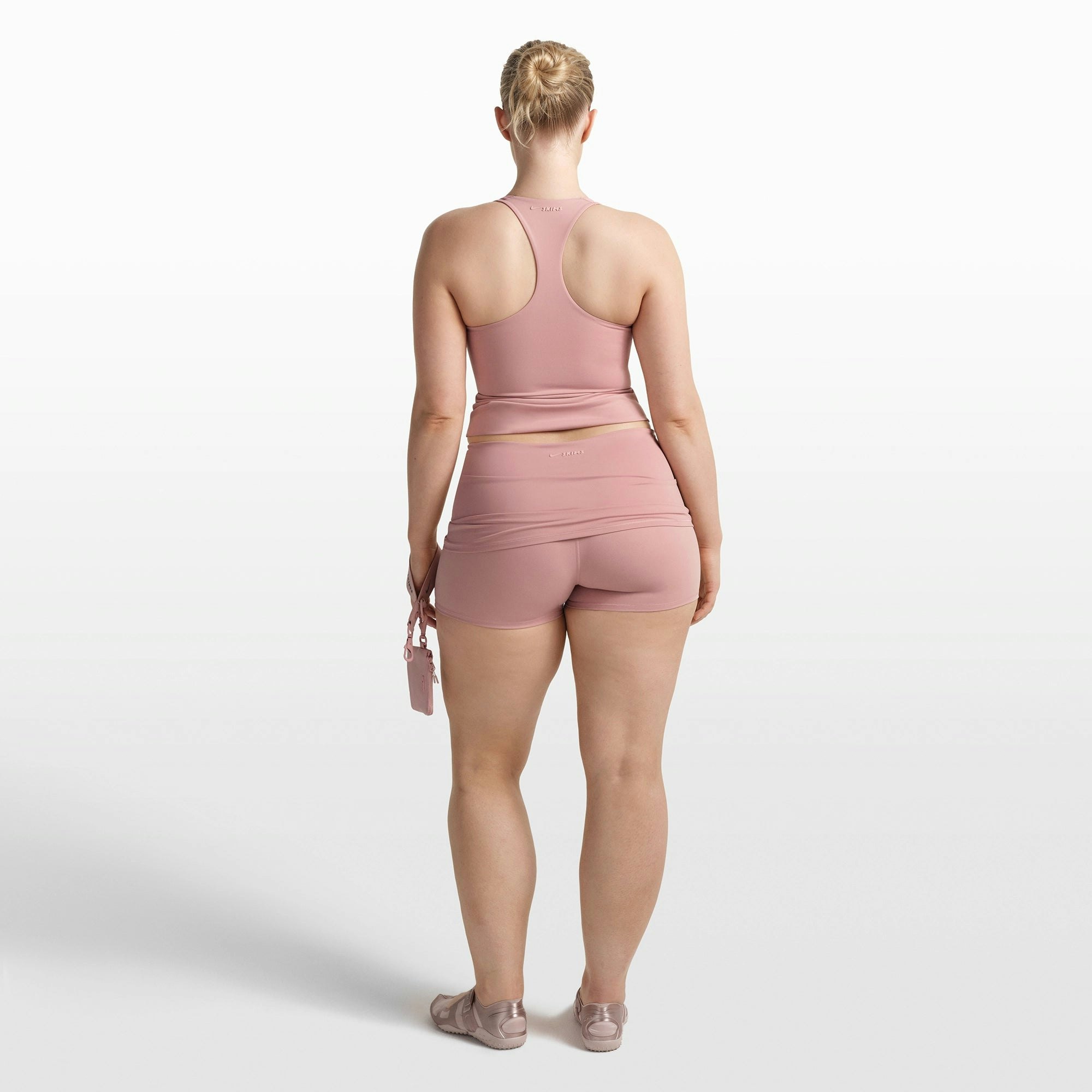 NikeSKIMS MATTE RACER BACK TANK | HIMALAYAN ON A MODEL FRONT VIEW @ | FOCUS: 0.0, 1.0, 0.9