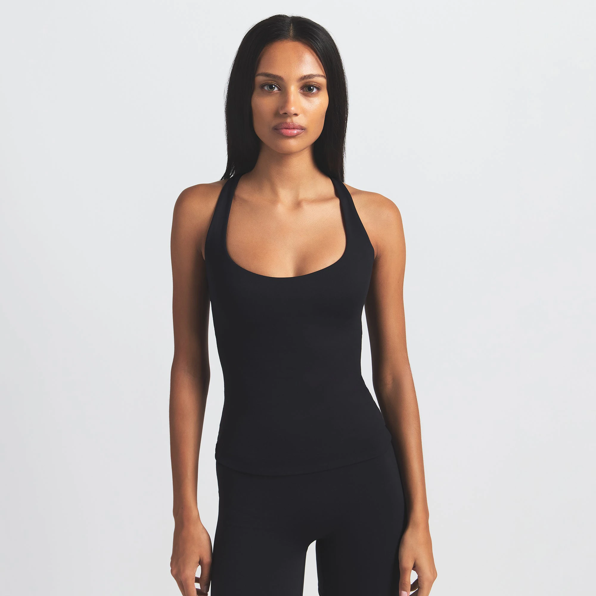 NikeSKIMS MATTE RACER BACK TANK | OBSIDIAN ON A MODEL FRONT VIEW