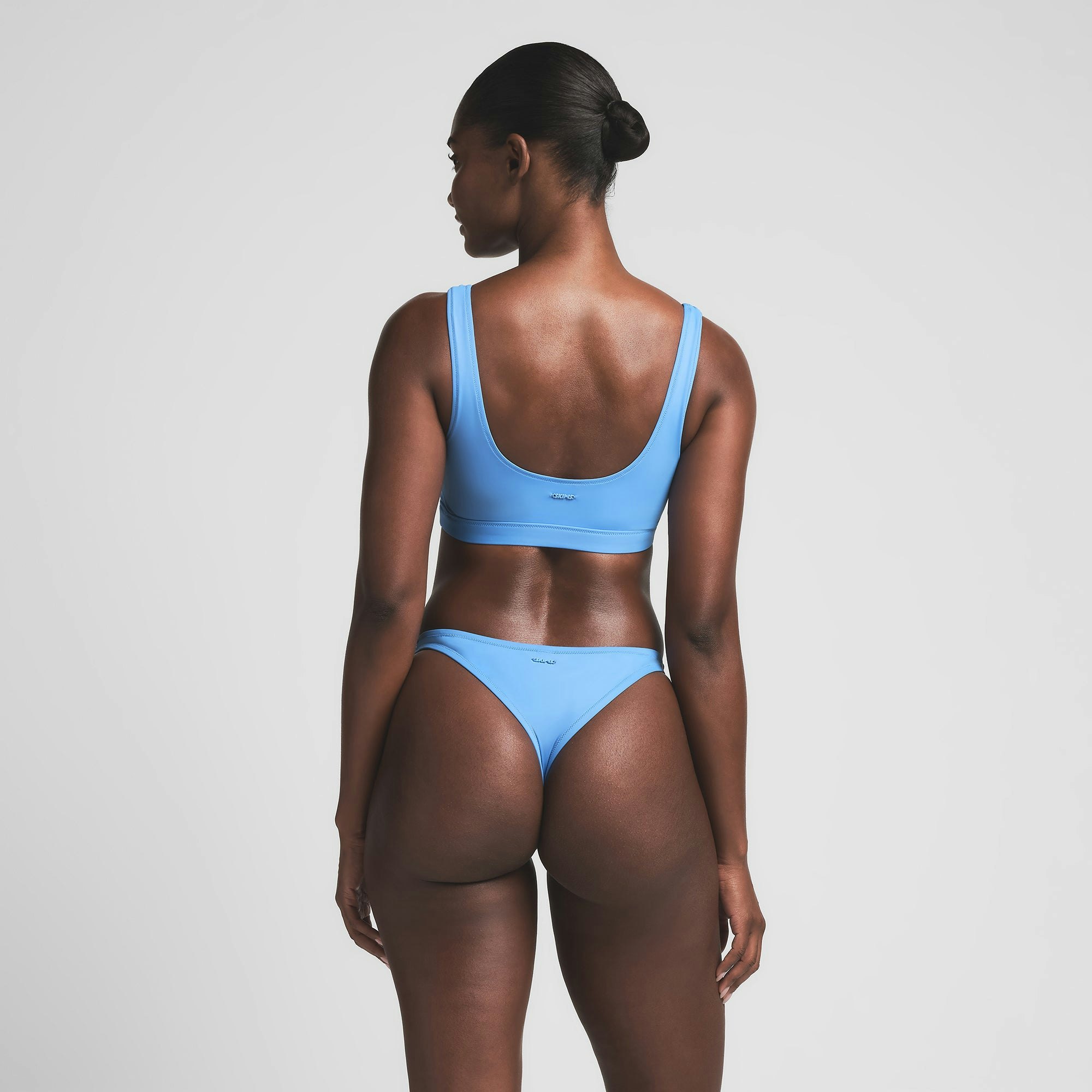 SIGNATURE SWIM TANK BIKINI TOP | TIDE ON A MODEL BACK VIEW | FOCUS: 0.0, 1.0, 0.9