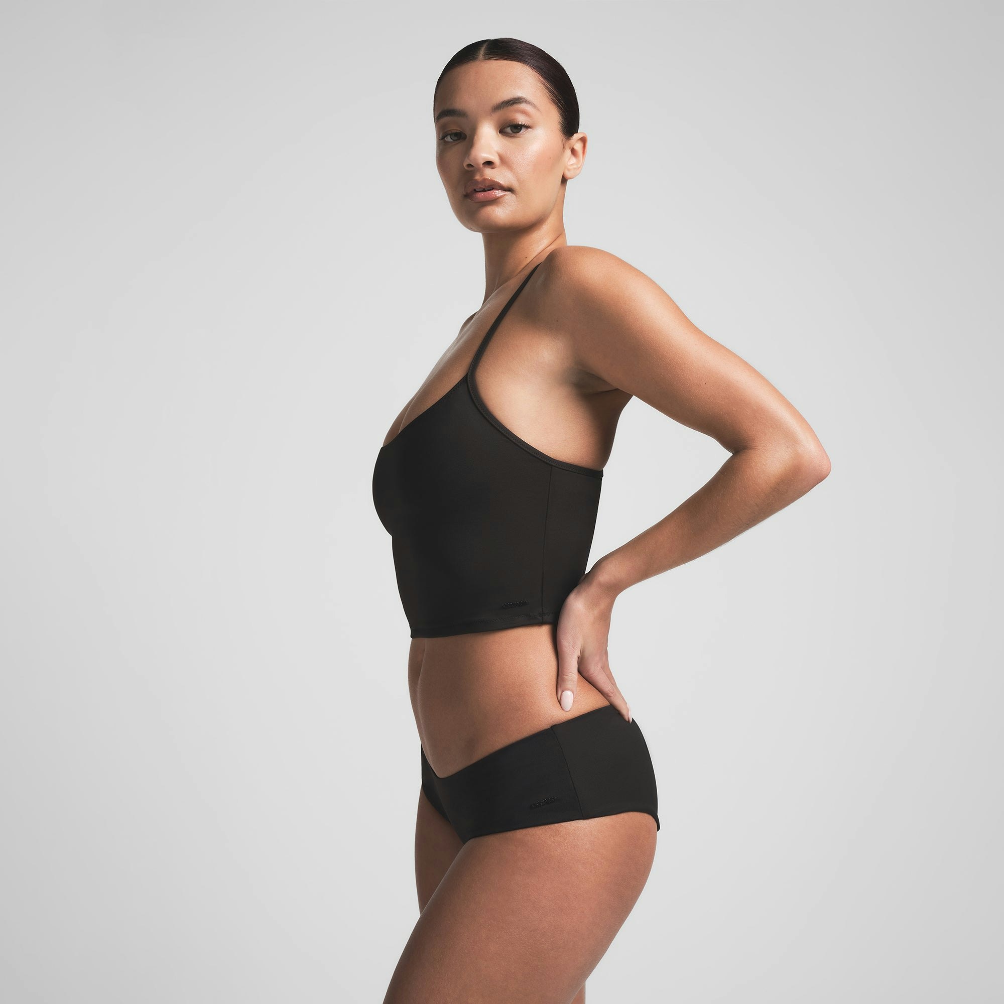 SIGNATURE SWIM CAMI TOP | ONYX ON A MODEL SIDE VIEW | FOCUS: 0.0, 1.0, 0.9