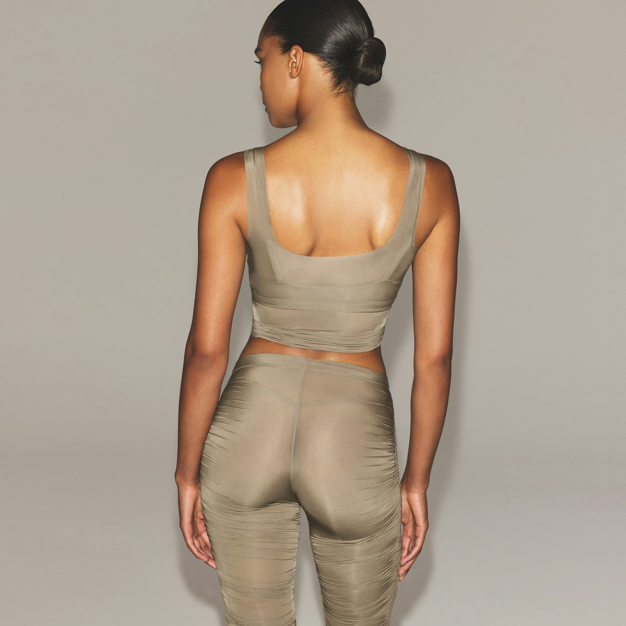 MILKY SHEER TANK | TRUFFLE ON A MODEL SIDE VIEW | FOCUS: 0.0, 1.0, 0.9