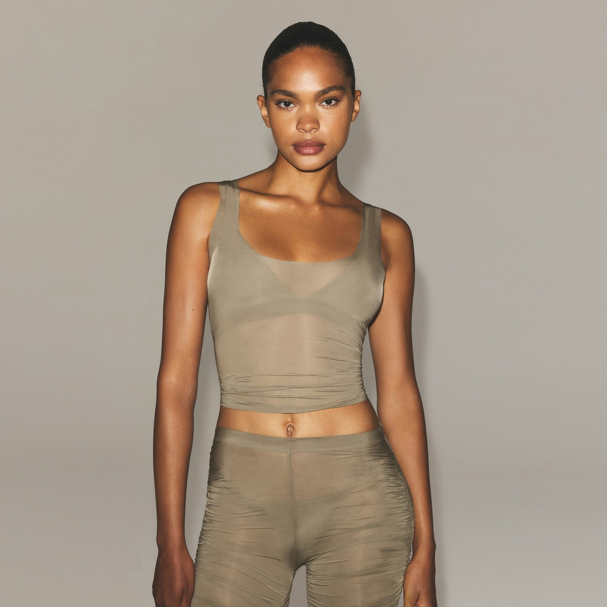 MILKY SHEER TANK | TRUFFLE ON A MODEL SIDE VIEW | FOCUS: 0.0, 1.0, 0.9