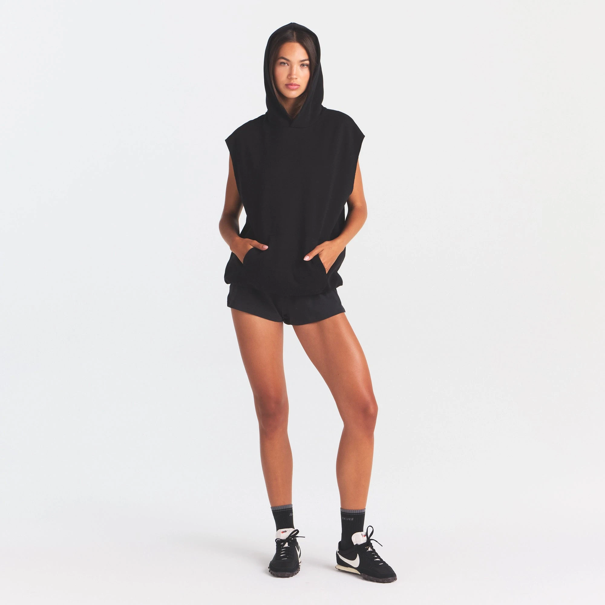 COTTON FLEECE OVERSIZED SLEEVELESS HOODIE | ONYX ON A MODEL FRONT VIEW