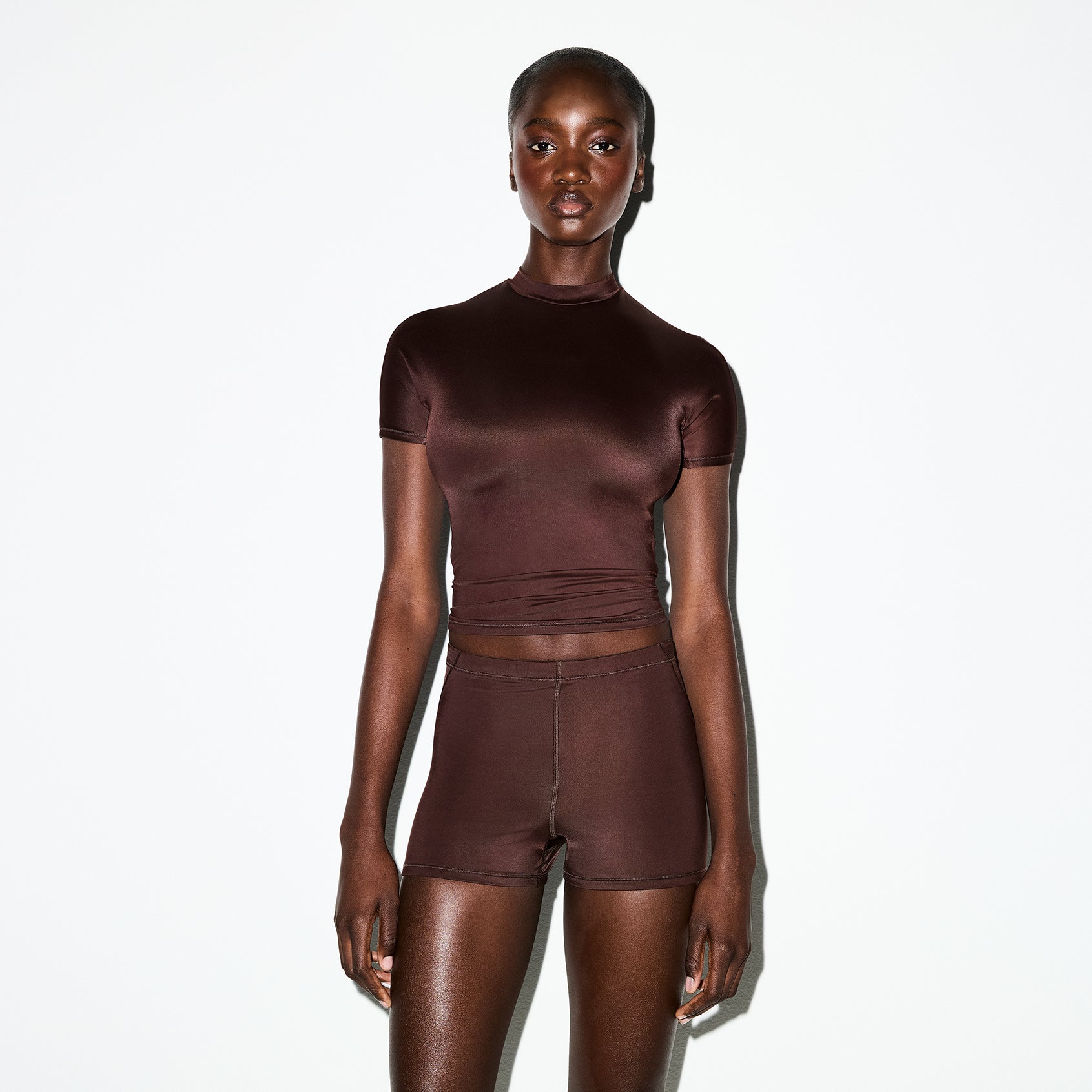 NikeSKIMS SHINE SHORT SLEEVE MOCK NECK TOP | PHOENIX ON A MODEL SIDE VIEW @ | FOCUS: 0.0, 1.0, 0.9