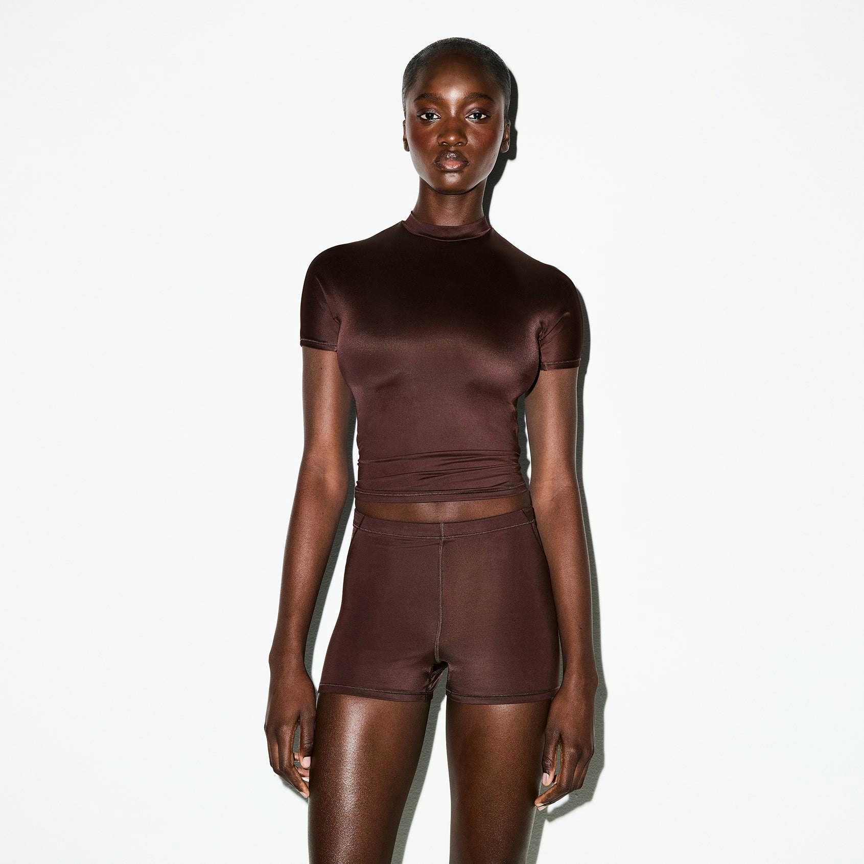 NikeSKIMS SHINE SHORT SLEEVE MOCK NECK TOP | PHOENIX ON A MODEL SIDE VIEW @ | FOCUS: 0.0, 1.0, 0.9