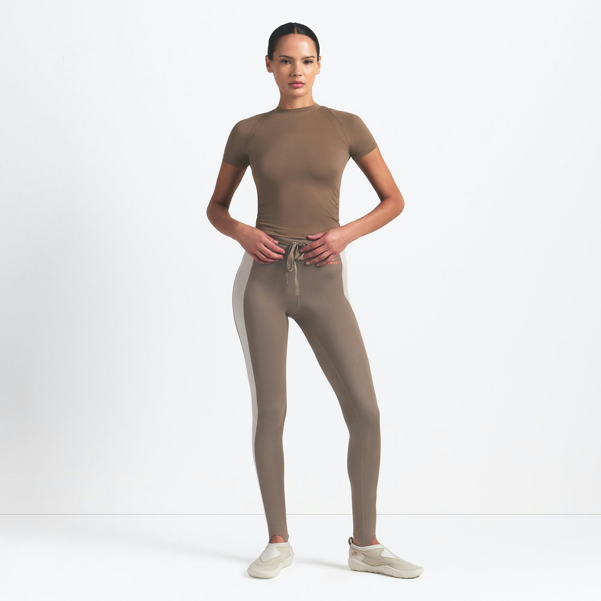 NikeSKIMS AIRY BABY TEE | MYRRH ON A MODEL FRONT VIEW @ | FOCUS: 0.0, 1.0, 0.9