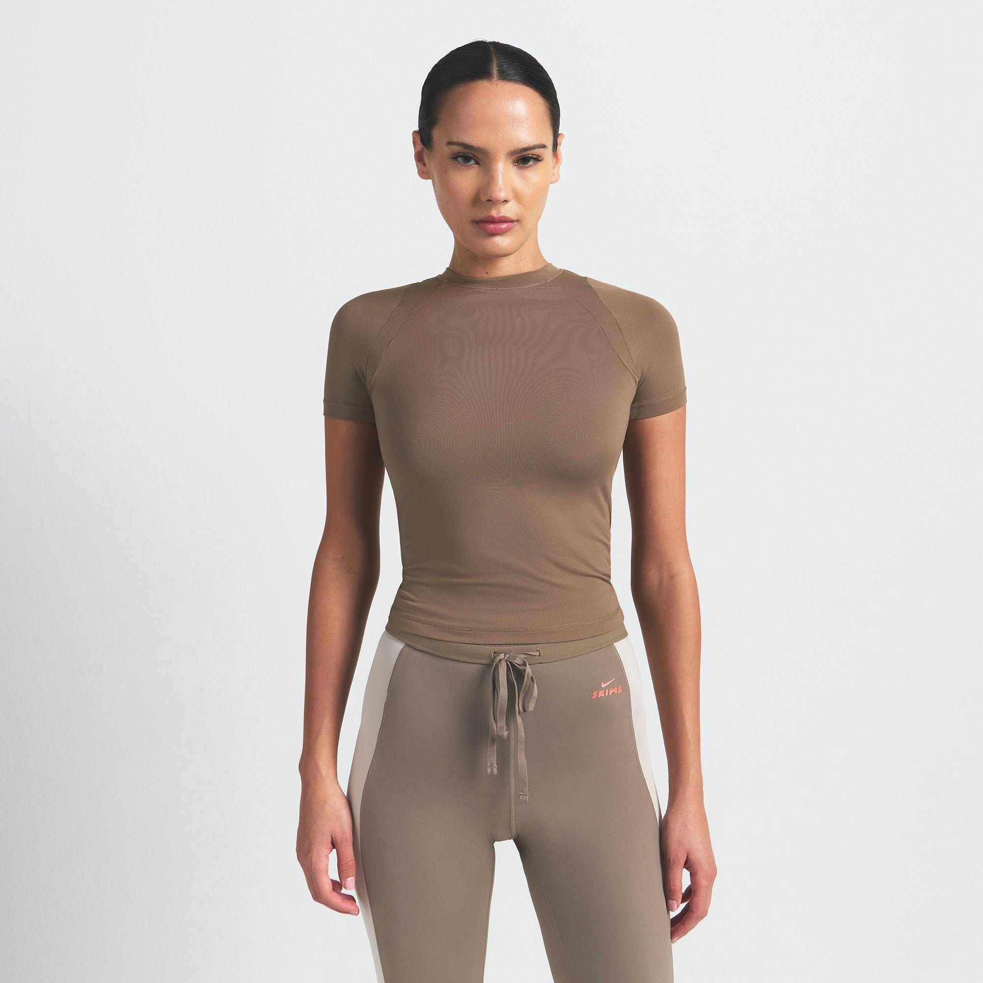 NikeSKIMS AIRY BABY TEE | MYRRH ON A MODEL SIDE VIEW @ | FOCUS: 0.0, 1.0, 0.9