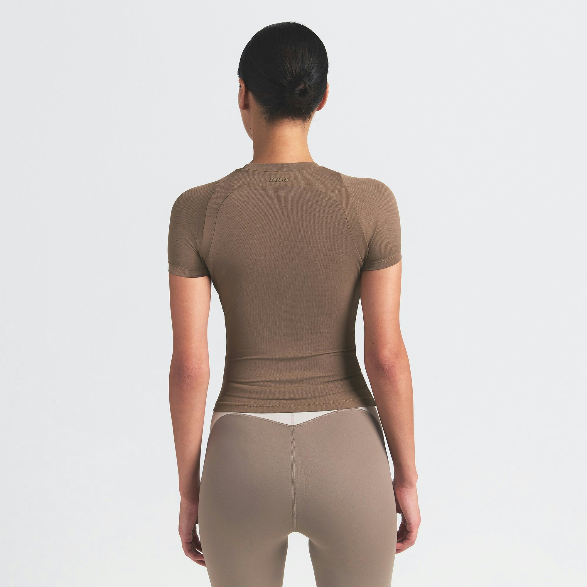 NikeSKIMS AIRY BABY TEE | MYRRH ON A MODEL SIDE VIEW @ | FOCUS: 0.0, 1.0, 0.9