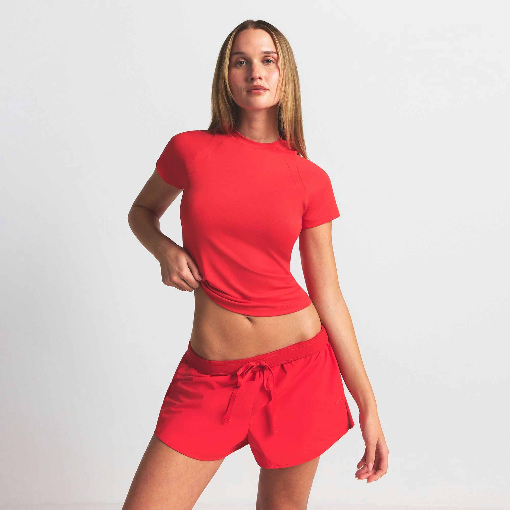 NikeSKIMS AIRY BABY TEE | RUBY ON A MODEL SIDE VIEW @ | FOCUS: 0.0, 1.0, 0.9