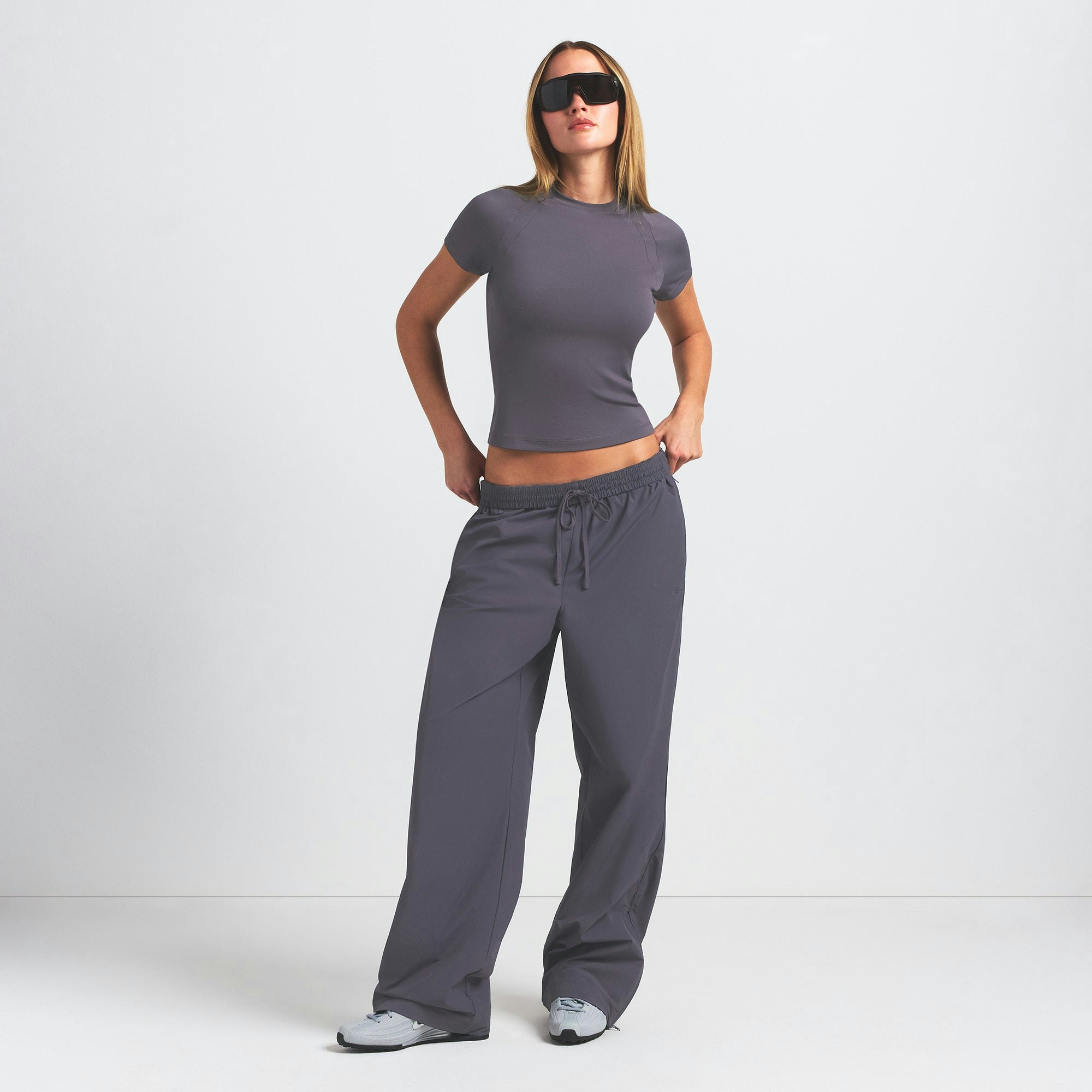 NikeSKIMS AIRY BABY TEE | RAVEN ON A MODEL FRONT VIEW @ | FOCUS: 0.0, 1.0, 0.9