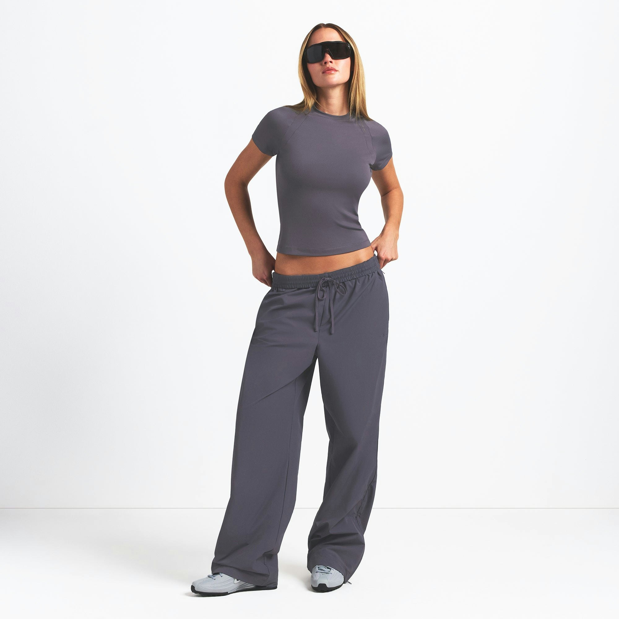 NikeSKIMS AIRY BABY TEE | RAVEN ON A MODEL FRONT VIEW @ | FOCUS: 0.0, 1.0, 0.9