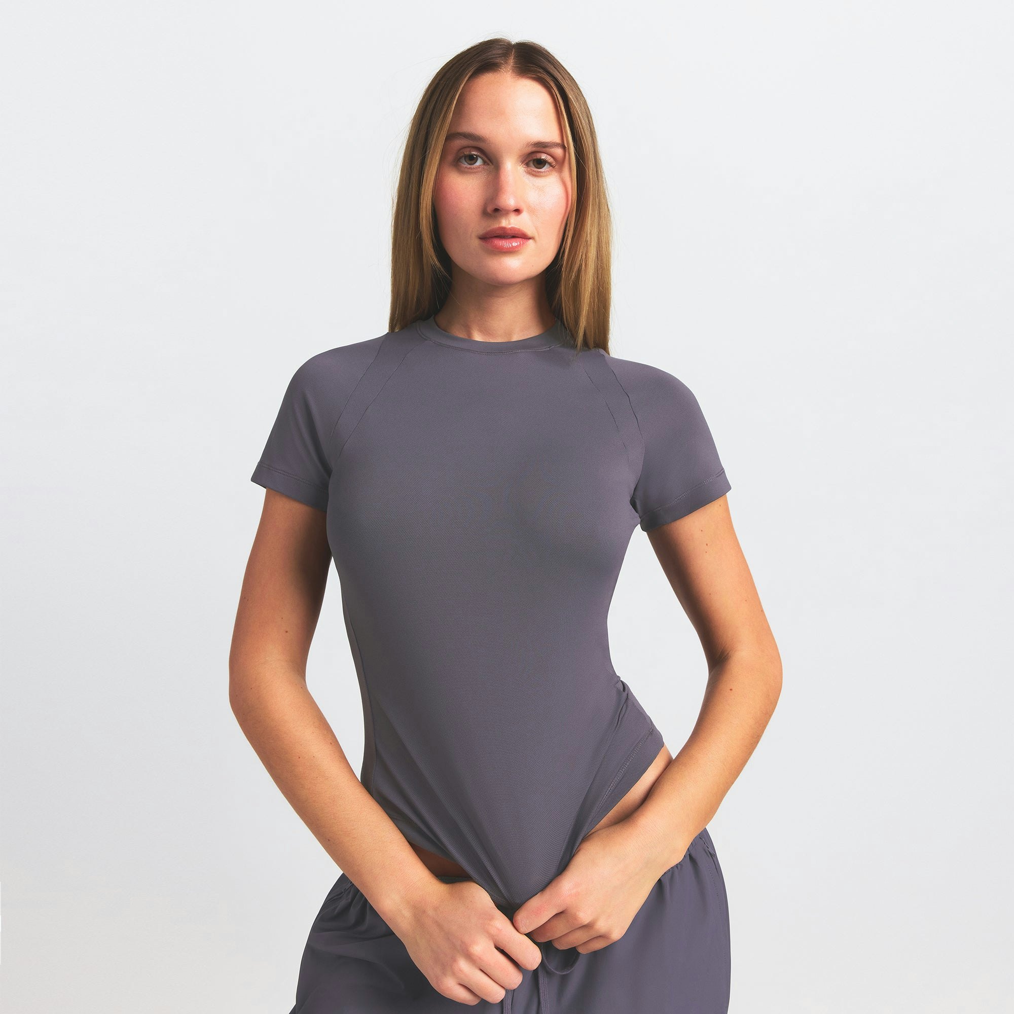 NikeSKIMS AIRY BABY TEE | RAVEN ON A MODEL SIDE VIEW @ | FOCUS: 0.0, 1.0, 0.9