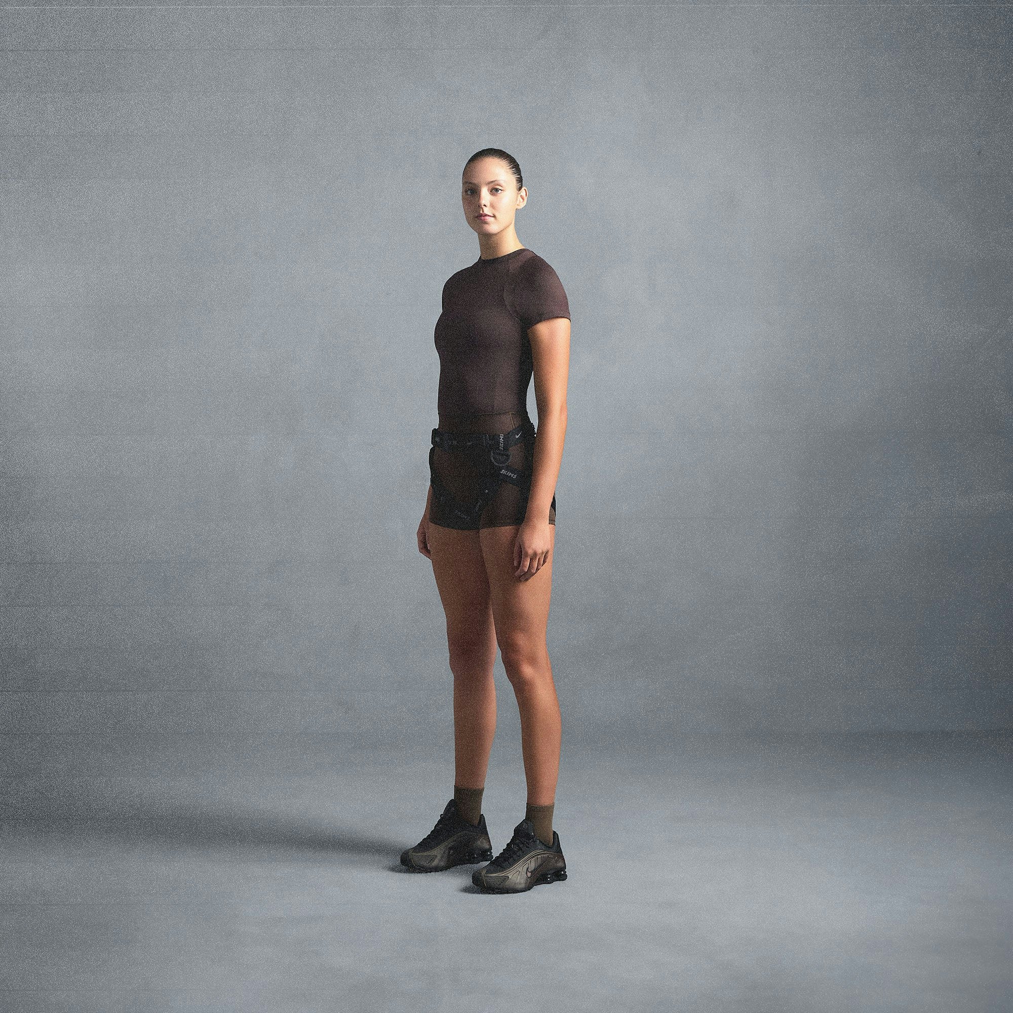 NikeSKIMS AIRY BABY TEE | DARK SEPIA ON A MODEL SIDE VIEW @ | FOCUS: 0.0, 1.0, 0.9