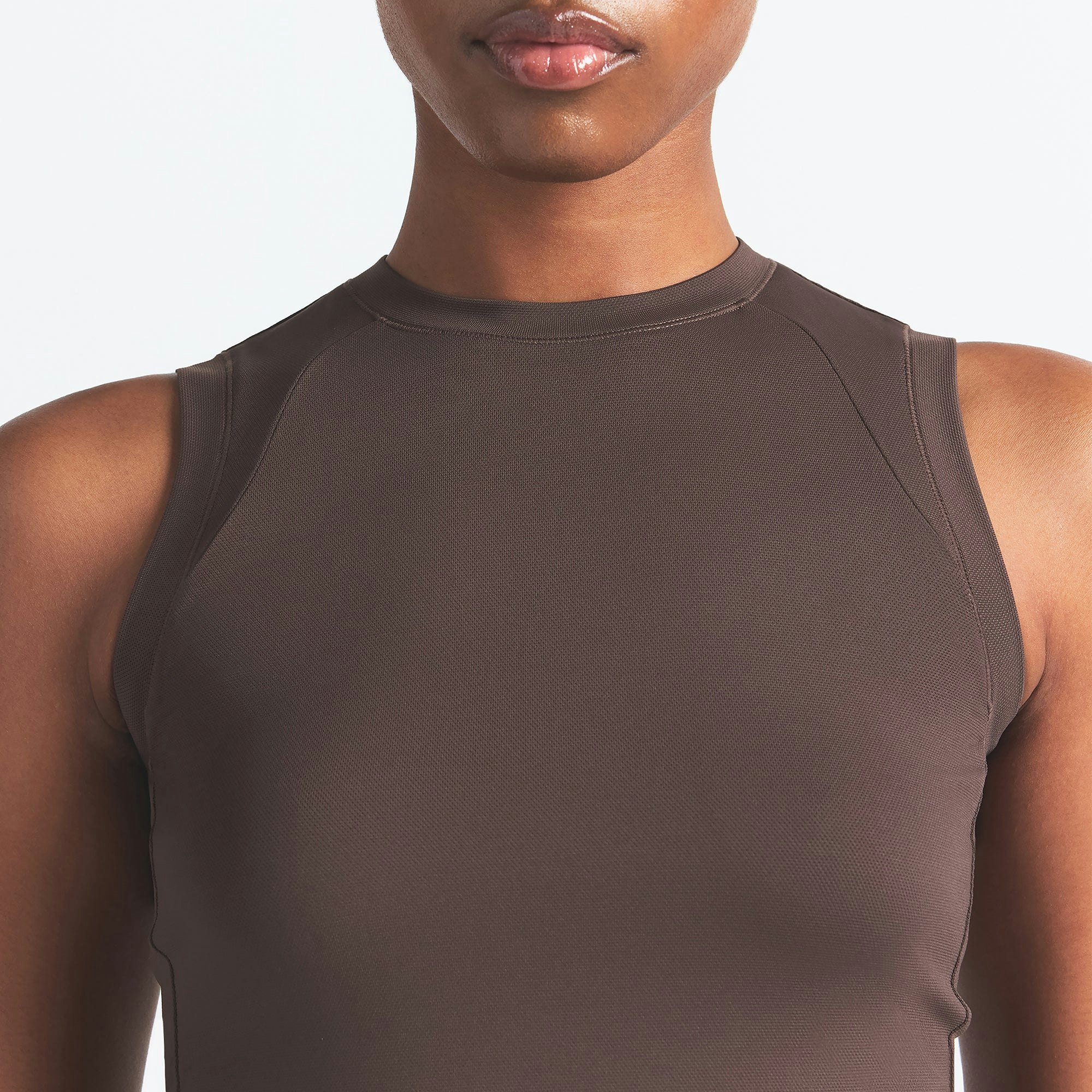 NikeSKIMS AIRY MUSCLE TEE | DARK SEPIA ON A MODEL SIDE VIEW @ | FOCUS: 0.0, 1.0, 0.9