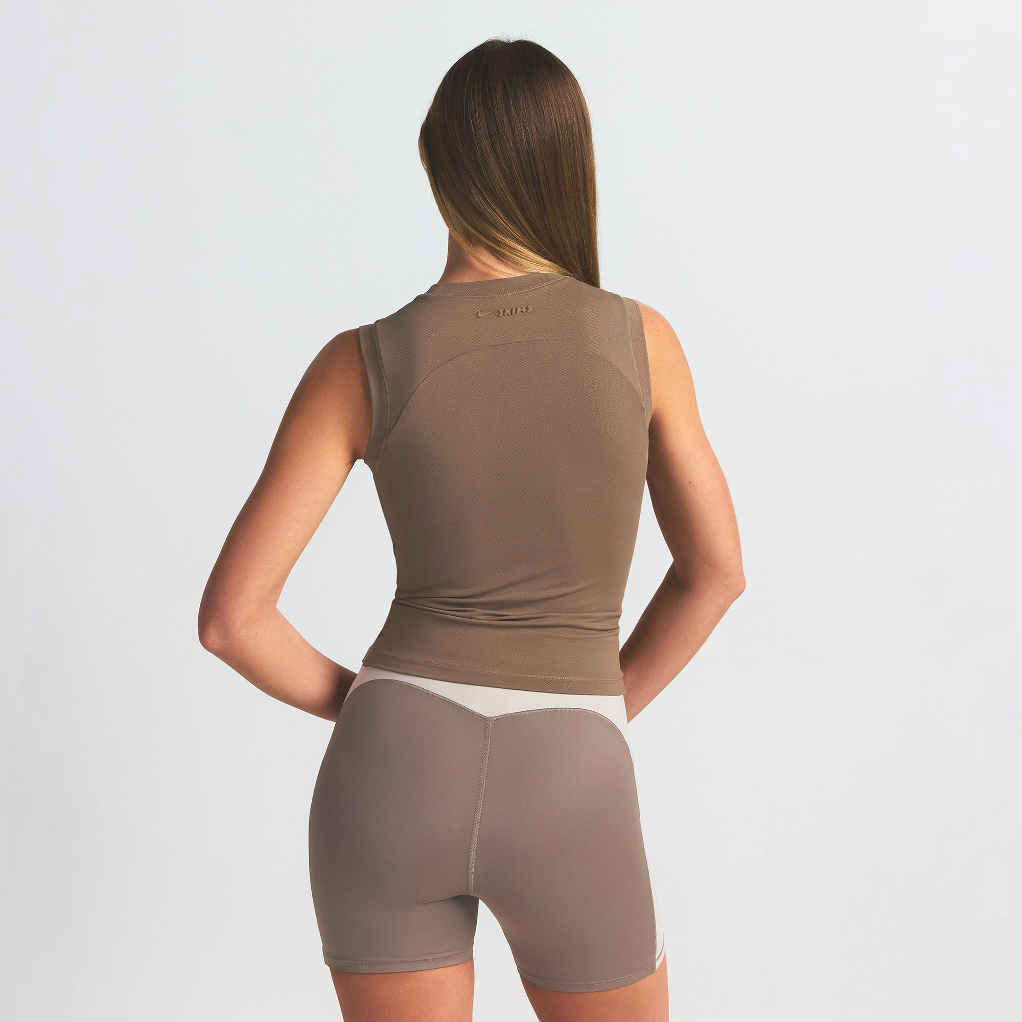 NikeSKIMS AIRY MUSCLE TEE | MYRRH ON A MODEL SIDE VIEW @ | FOCUS: 0.0, 1.0, 0.9