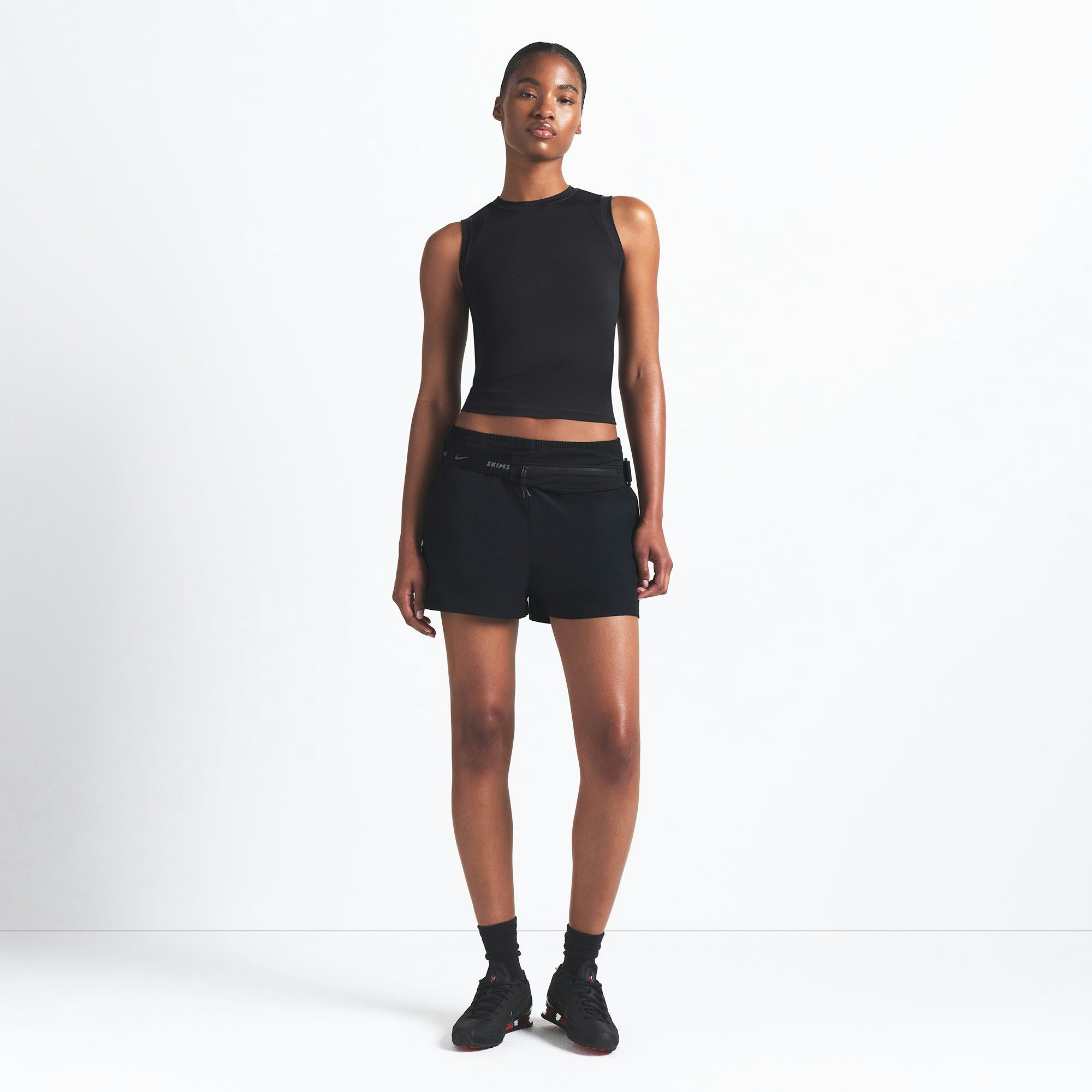 NikeSKIMS AIRY MUSCLE TEE | OBSIDIAN ON A MODEL FRONT VIEW @ | FOCUS: 0.9, 0.1, 0.7