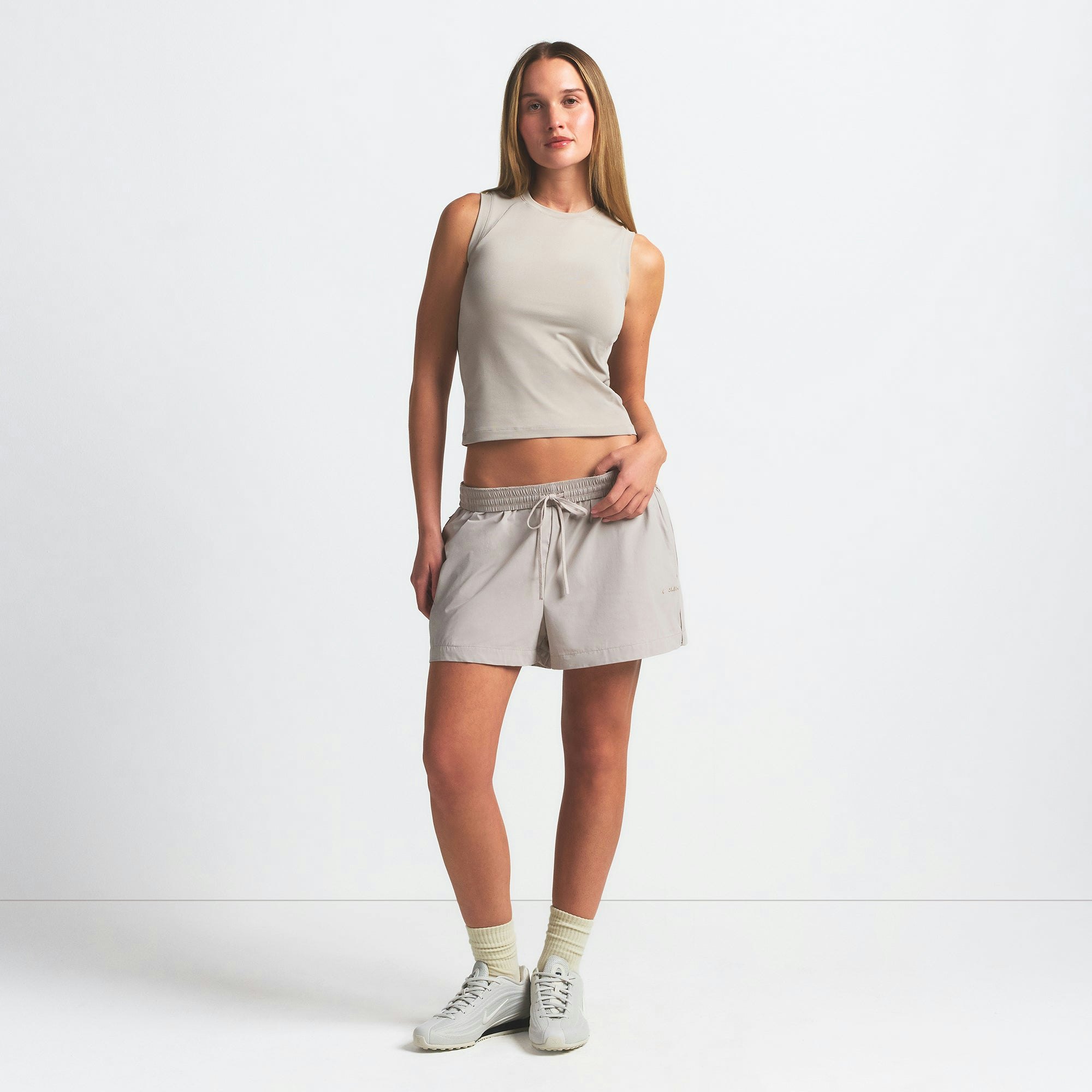 NikeSKIMS AIRY MUSCLE TEE | STONE ON A MODEL FRONT VIEW @ | FOCUS: 0.0, 1.0, 0.9