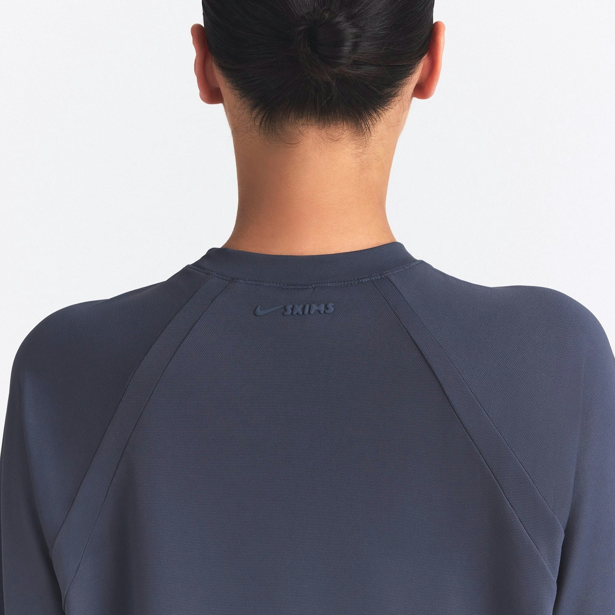 NikeSKIMS AIRY OVERSIZED TEE | DEEP ROYAL ON A MODEL SIDE VIEW @ | FOCUS: 0.0, 1.0, 0.9