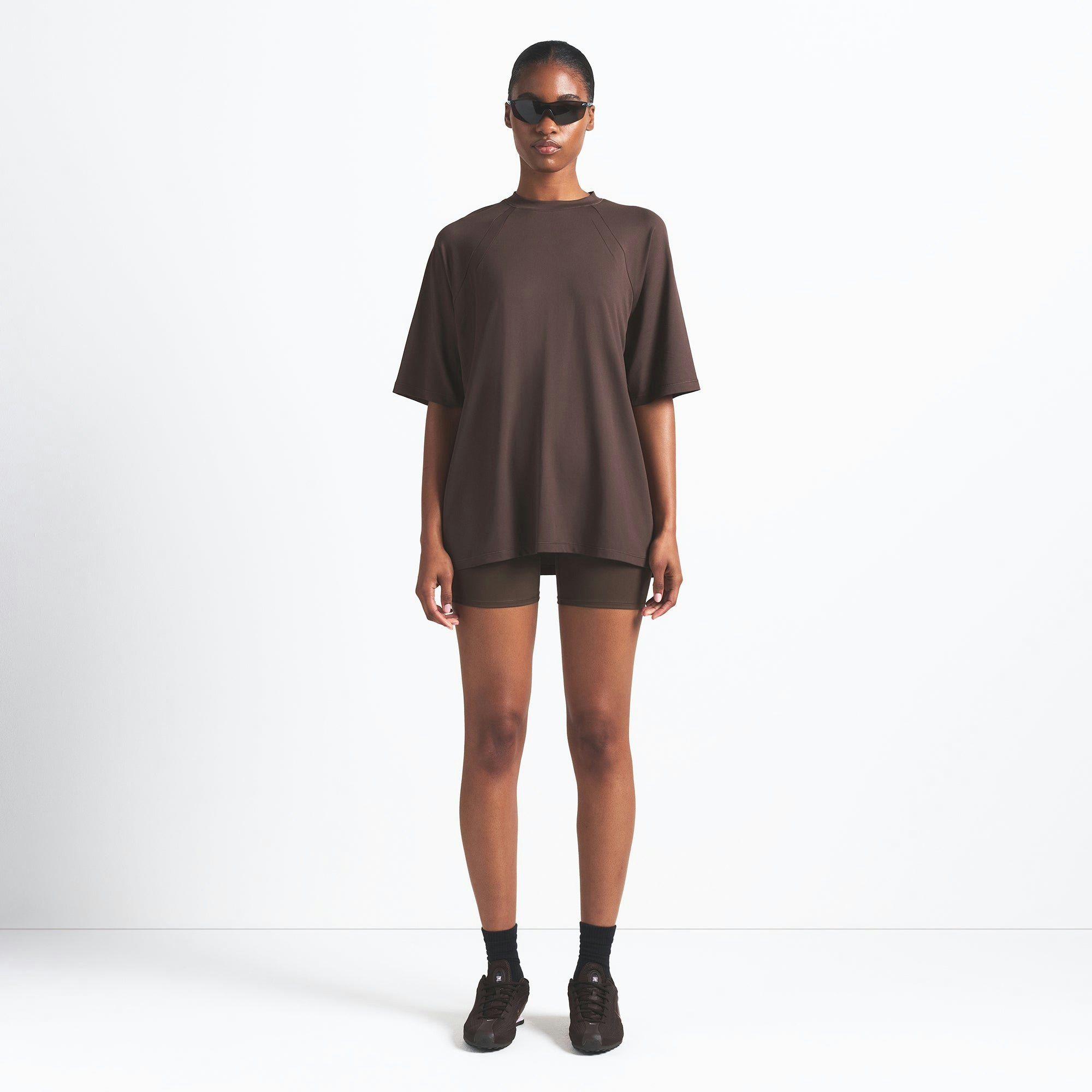 NikeSKIMS AIRY OVERSIZED TEE | DARK SEPIA ON A MODEL FRONT VIEW @ | FOCUS: 0.0, 1.0, 0.9