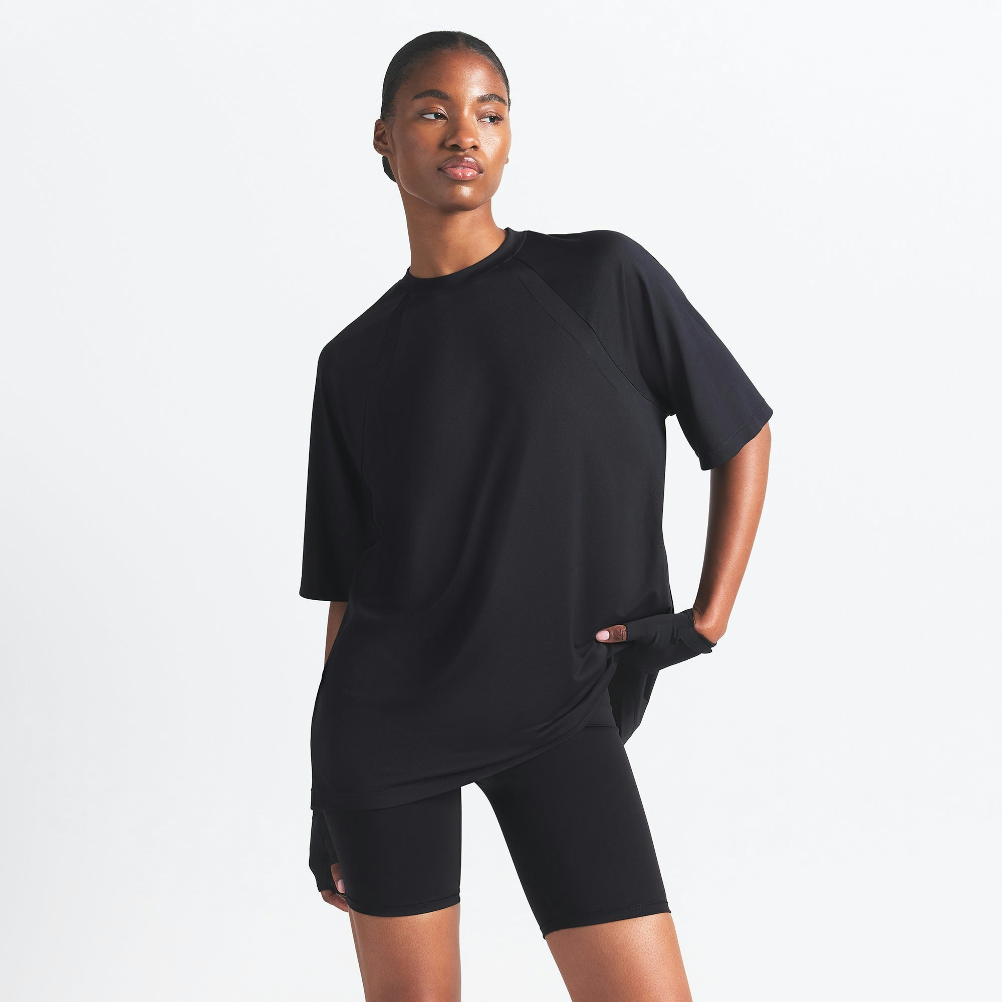 NikeSKIMS AIRY OVERSIZED TEE | OBSIDIAN ON A MODEL SIDE VIEW @ | FOCUS: 0.0, 1.0, 0.9