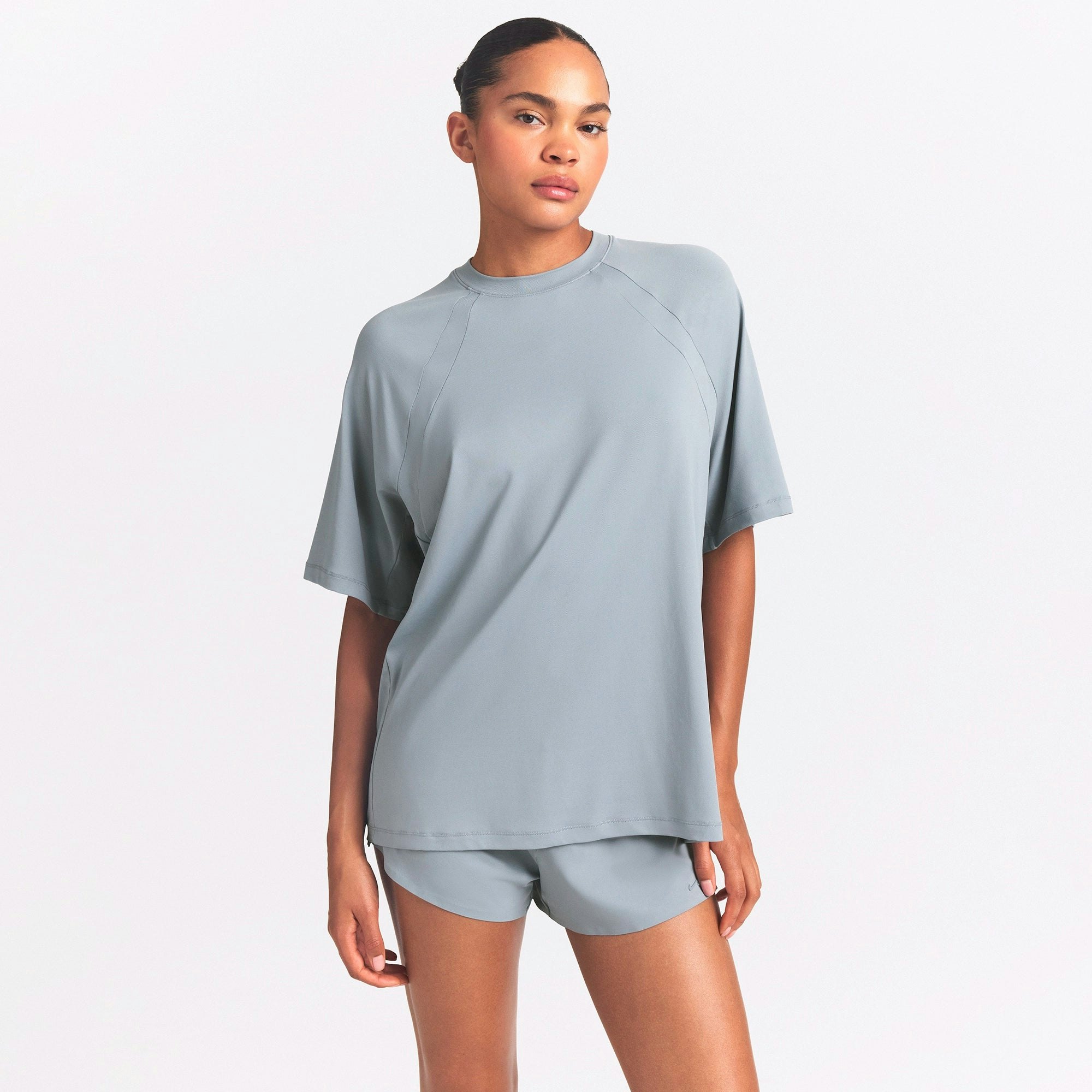 NikeSKIMS AIRY OVERSIZED TEE | WASHED PACIFIC ON A MODEL SIDE VIEW @ | FOCUS: 0.0, 1.0, 0.9