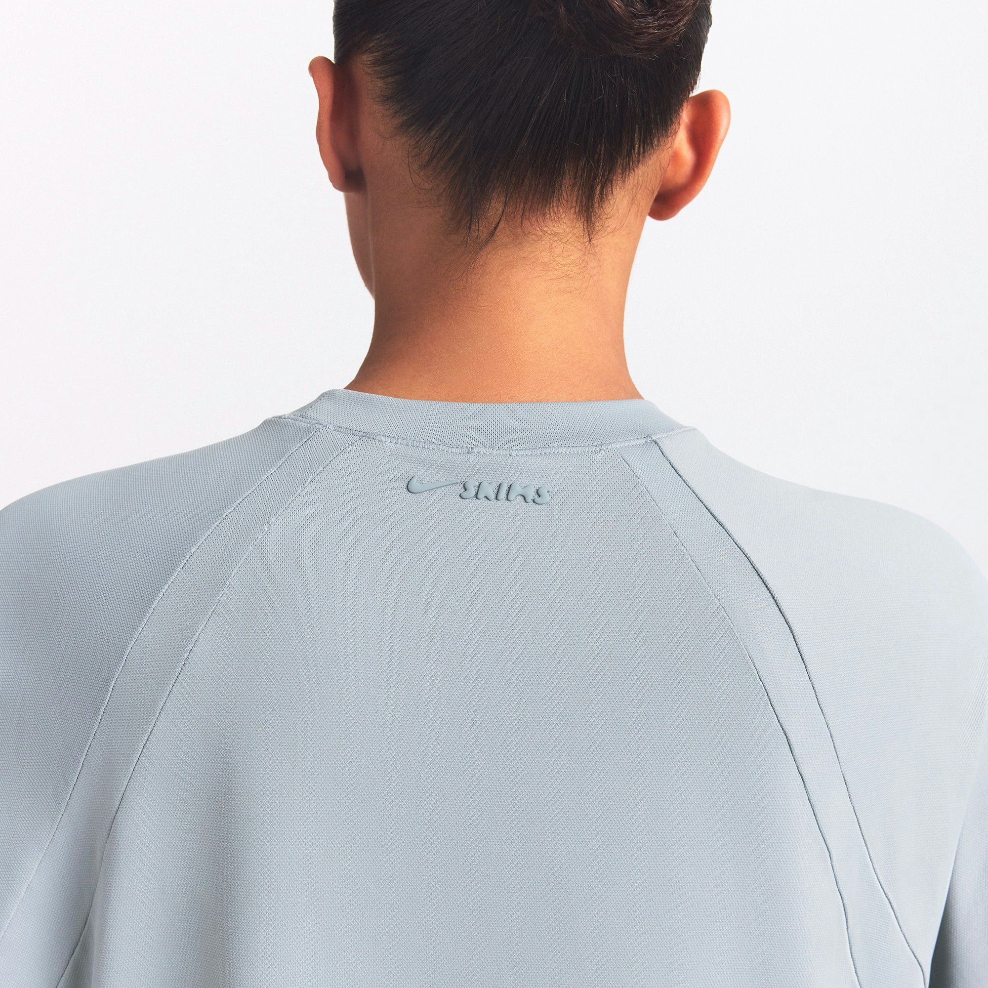 NikeSKIMS AIRY OVERSIZED TEE | WASHED PACIFIC ON A MODEL SIDE VIEW @ | FOCUS: 0.0, 1.0, 0.9