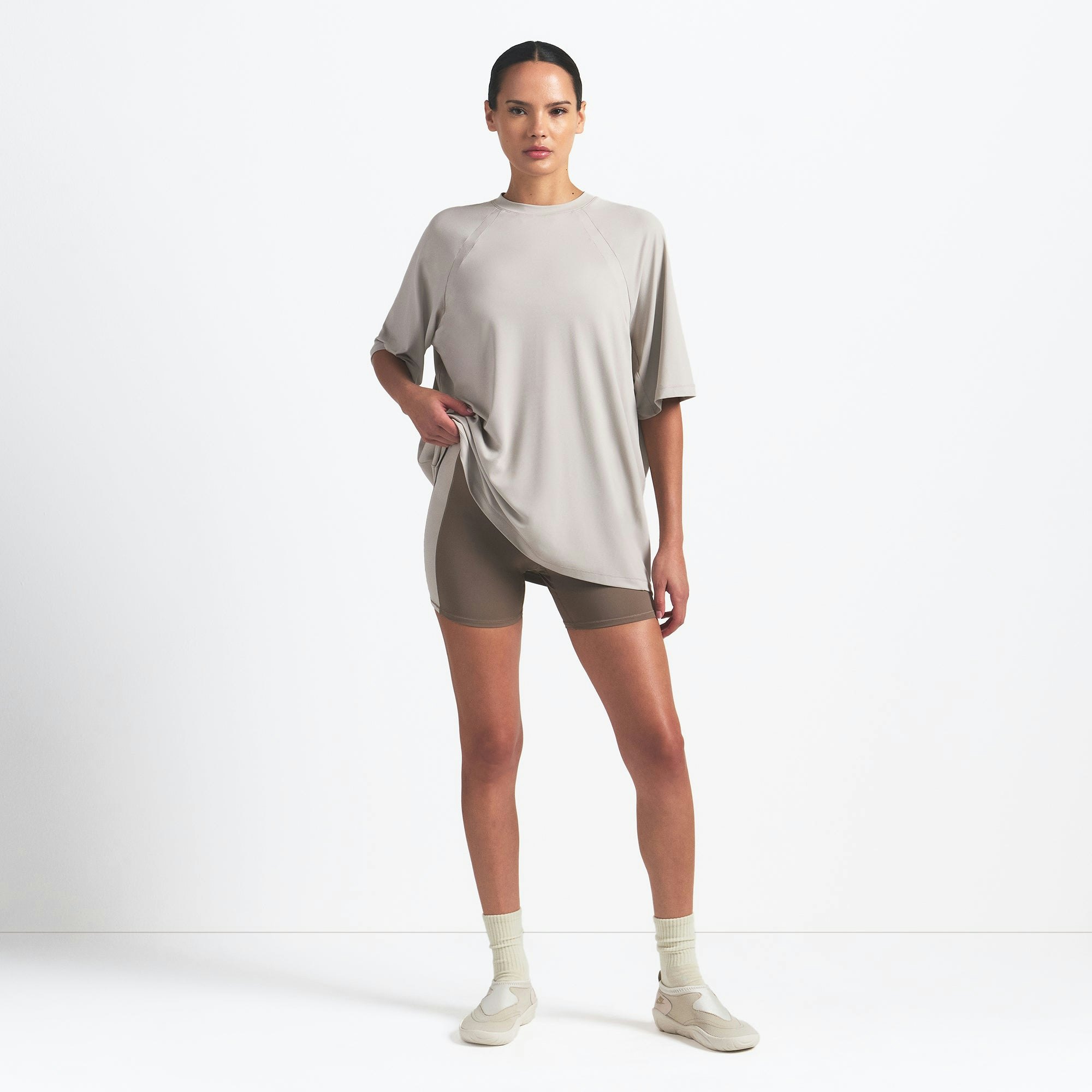NikeSKIMS AIRY OVERSIZED TEE | STONE ON A MODEL FRONT VIEW @ | FOCUS: 0.0, 1.0, 0.9