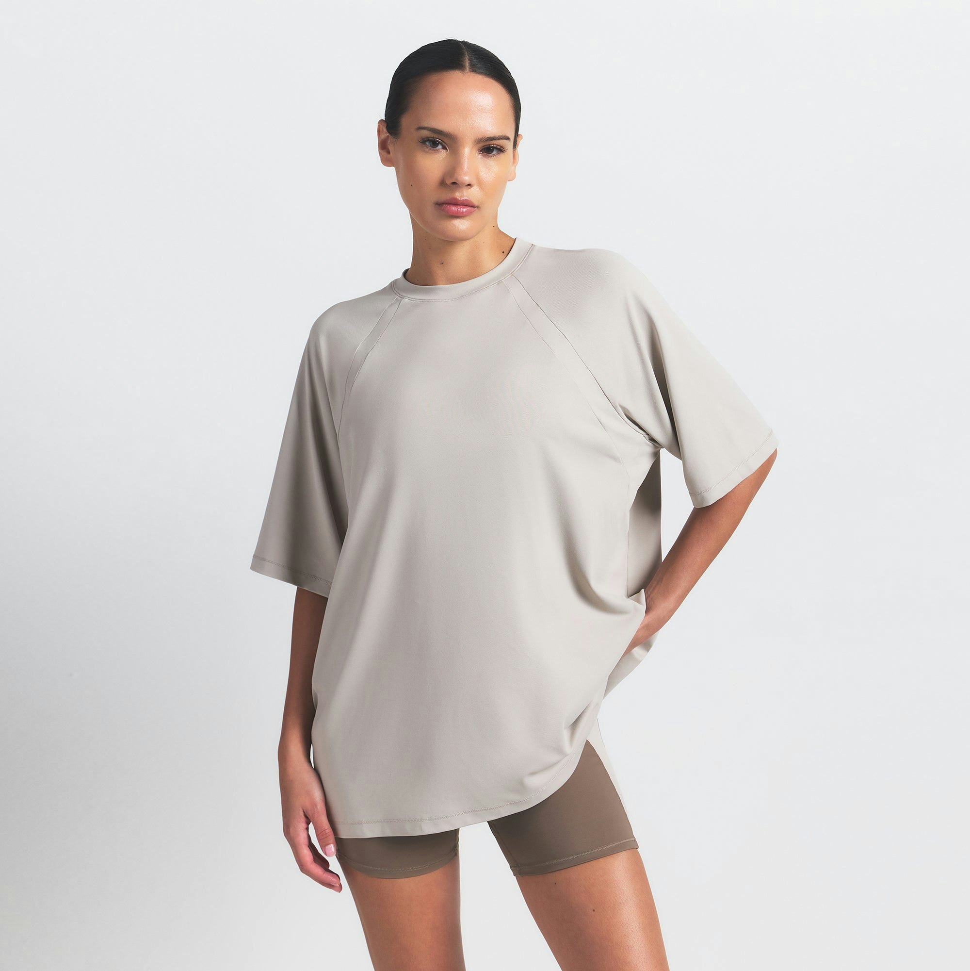 NikeSKIMS AIRY OVERSIZED TEE | STONE ON A MODEL SIDE VIEW @ | FOCUS: 0.0, 1.0, 0.9