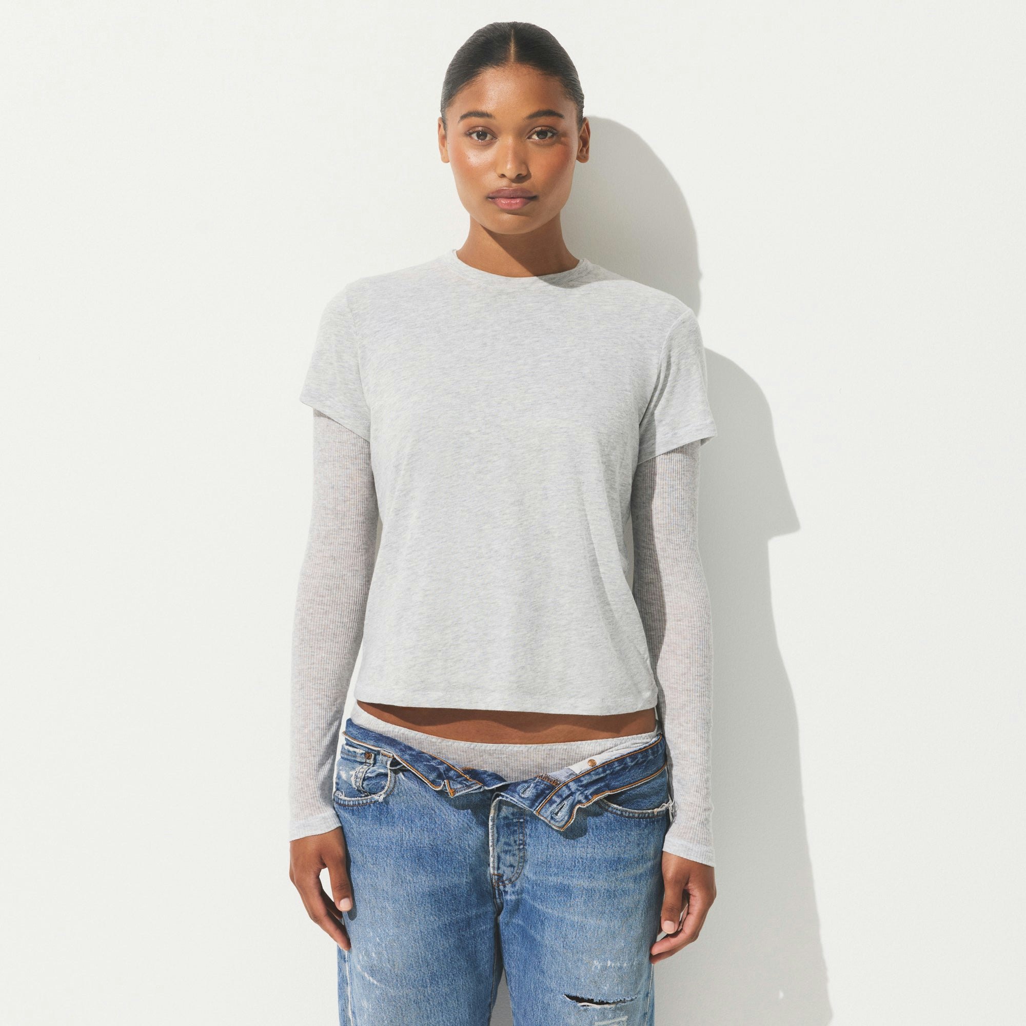 SHEER COTTON JERSEY T-SHIRT | LIGHT HEATHER GREY ON A MODEL SIDE VIEW | FOCUS: 0.0, 1.0, 0.9