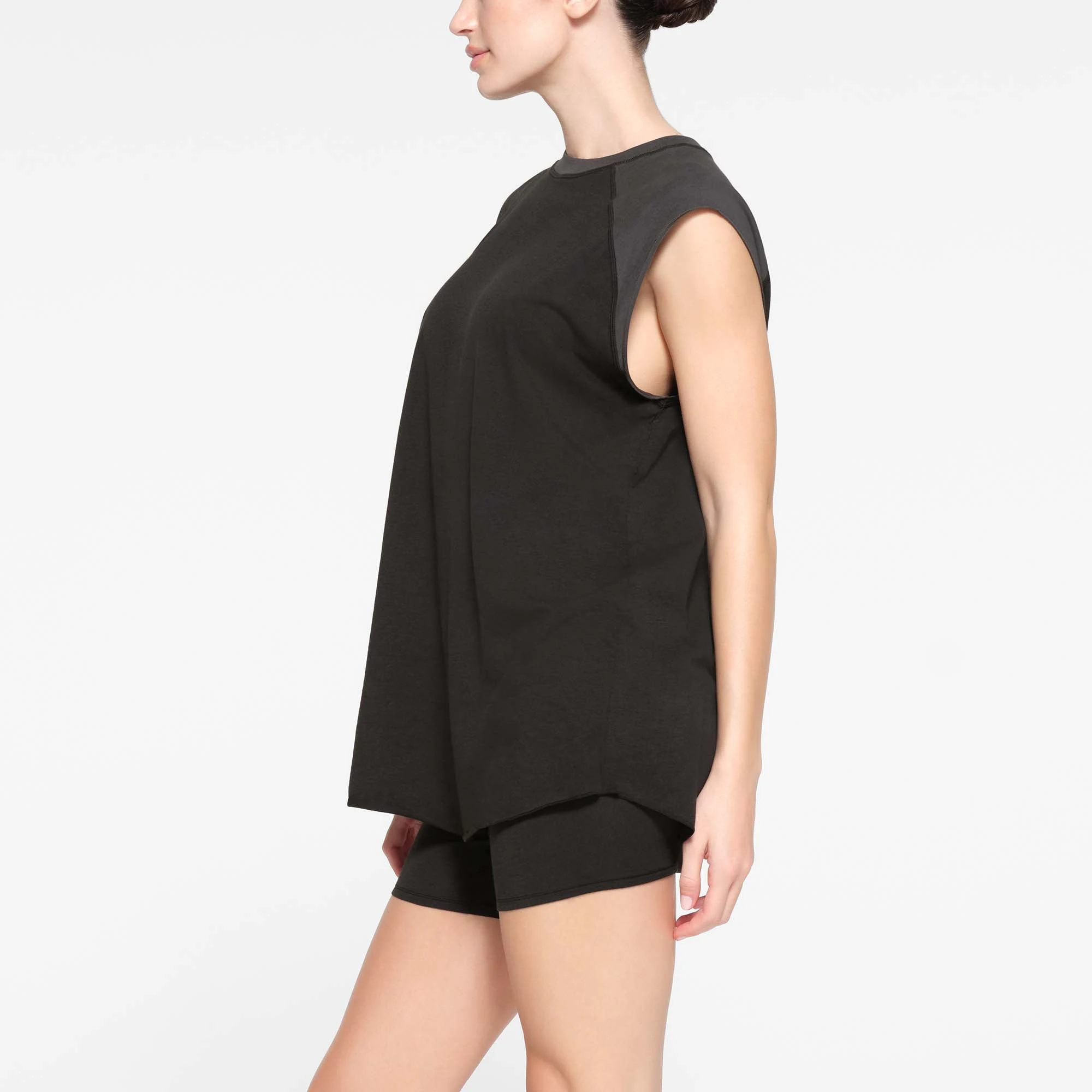 BOYFRIEND MUSCLE TANK | ONYX AND ASH ON A MODEL SIDE VIEW