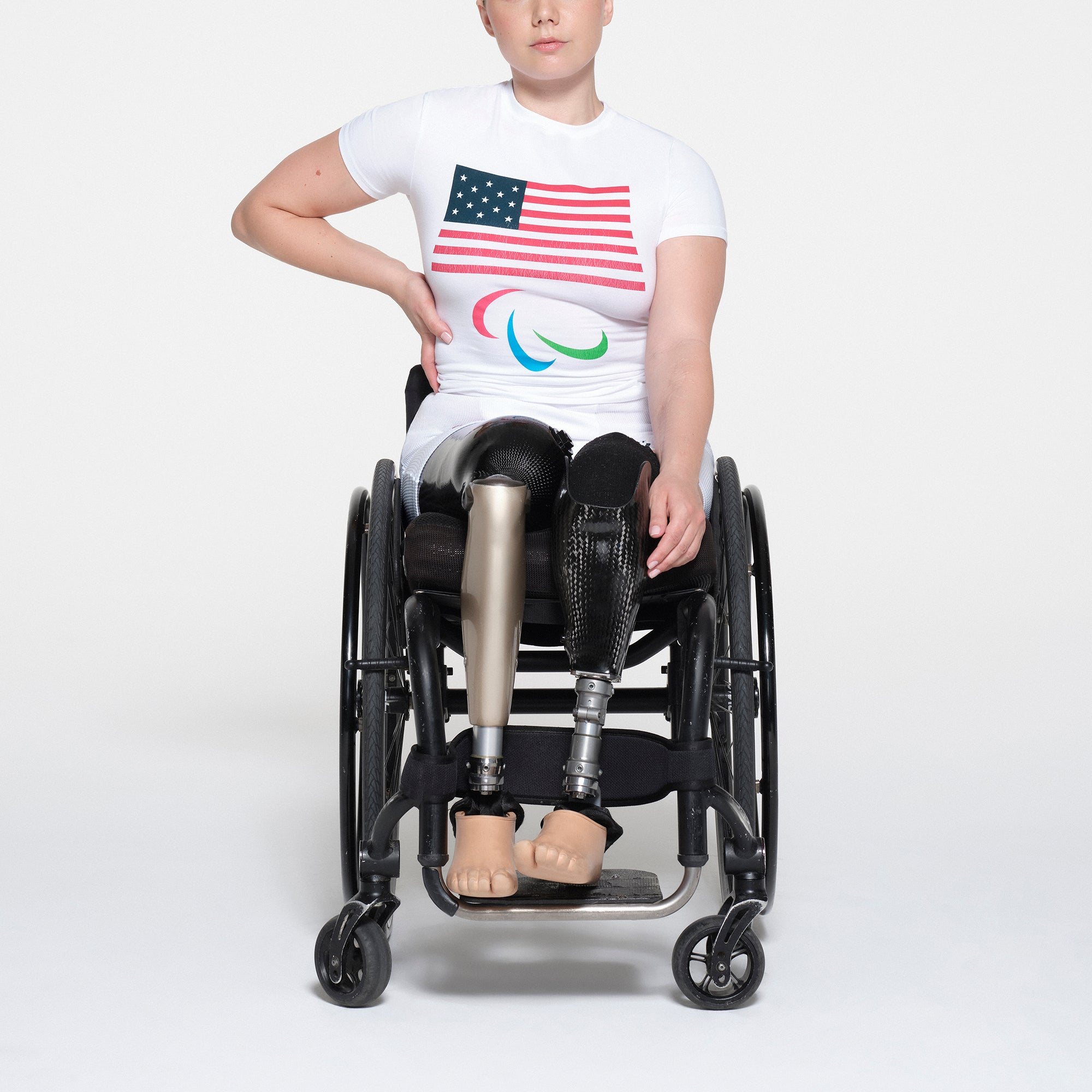 SKIMS FOR TEAM USA COTTON JERSEY PARALYMPIC T-SHIRT | WHITE ON A MODEL FRONT VIEW | FOCUS: 0.1, 1, 0.9