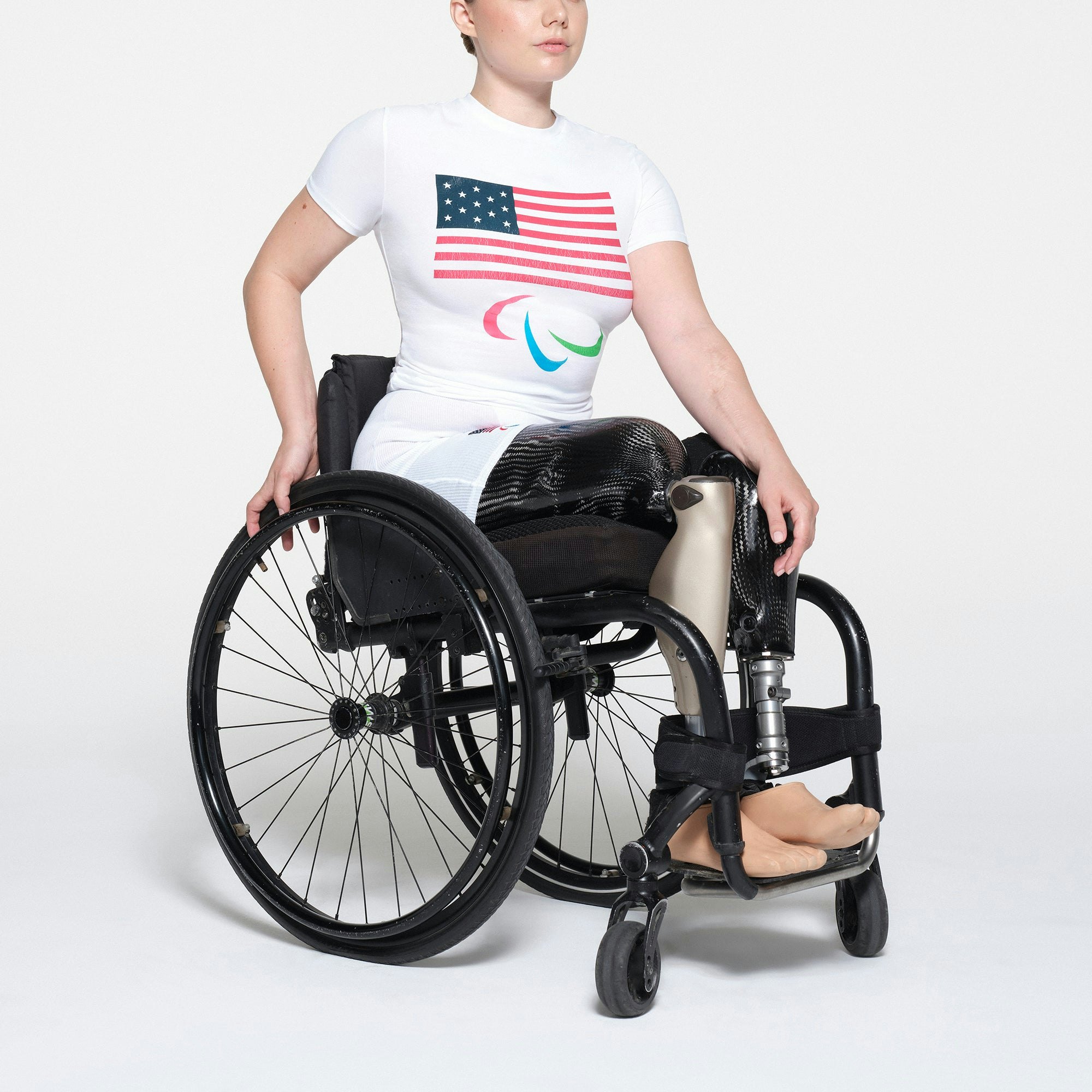 SKIMS FOR TEAM USA COTTON JERSEY PARALYMPIC T-SHIRT | WHITE ON A MODEL SIDE VIEW