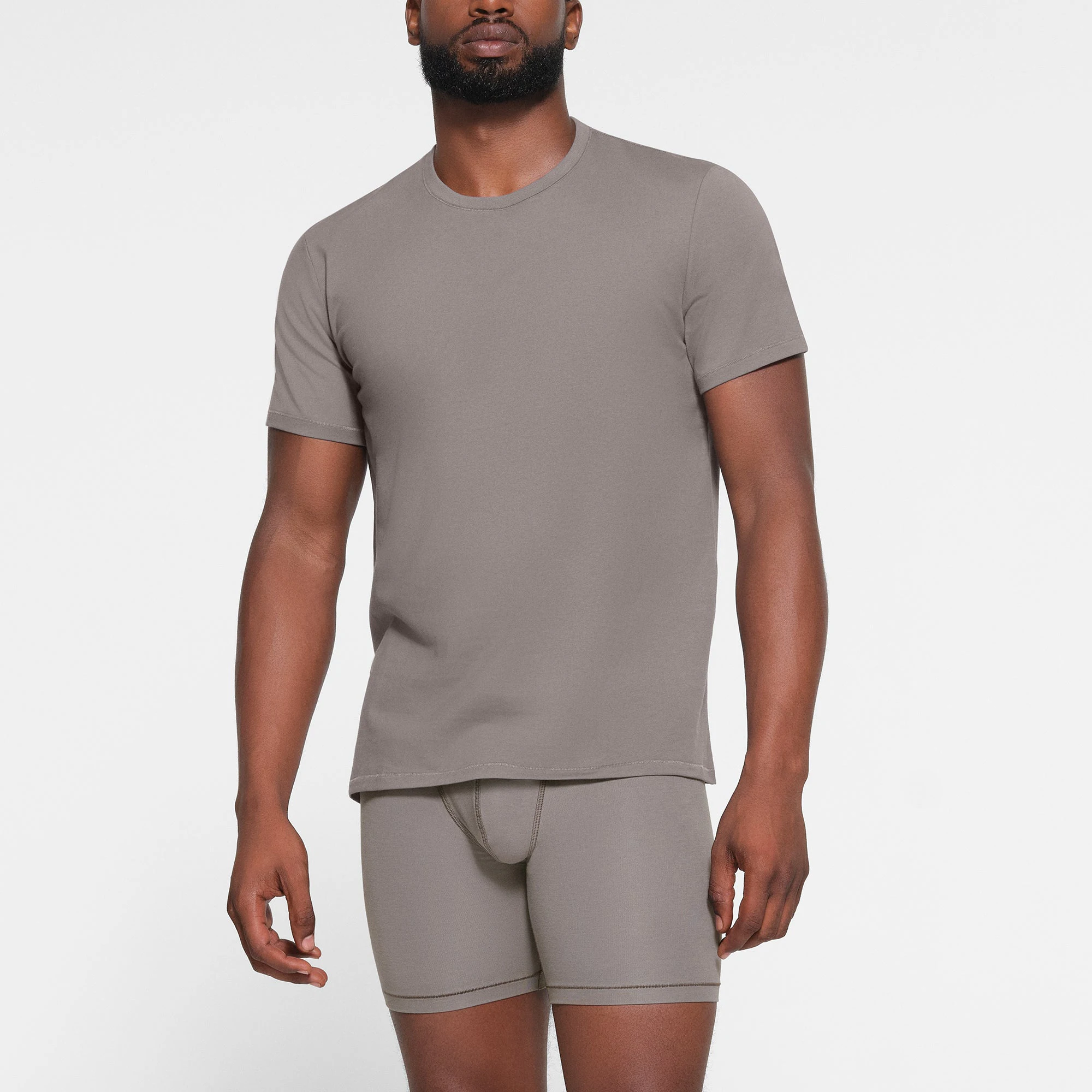 SKIMS COTTON MENS T-SHIRT WORN BY A MODEL IN FRONT VIEW