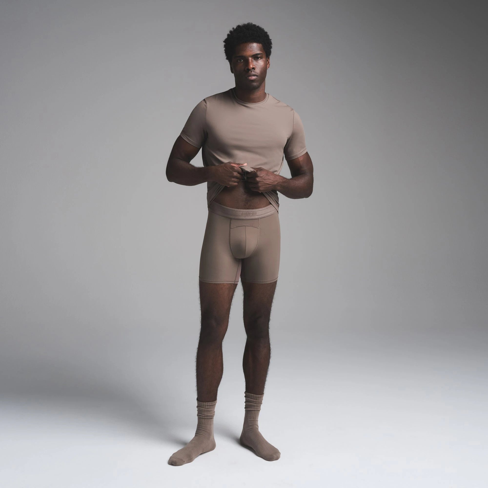 SKIMS SPORT MENS T-SHIRT | AMETHYST ON A MODEL FRONT VIEW | FOCUS: 0.0, 1.0, 0.9