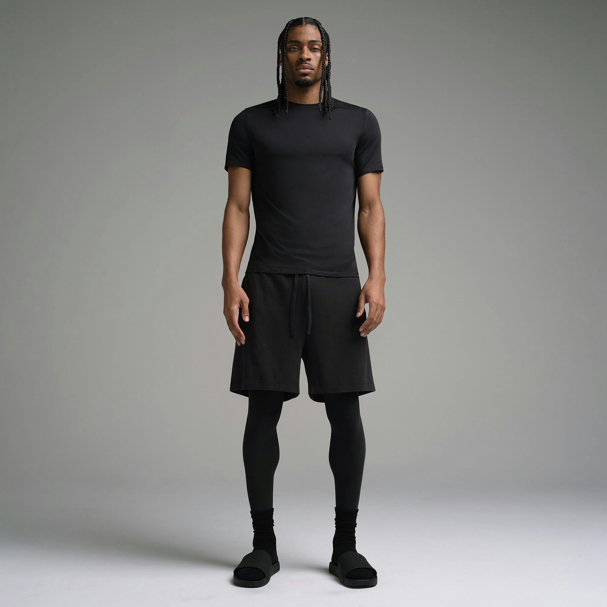 SKIMS SPORT MENS T-SHIRT | OBSIDIAN ON A MODEL FRONT VIEW | FOCUS: 0.0, 1.0, 0.9