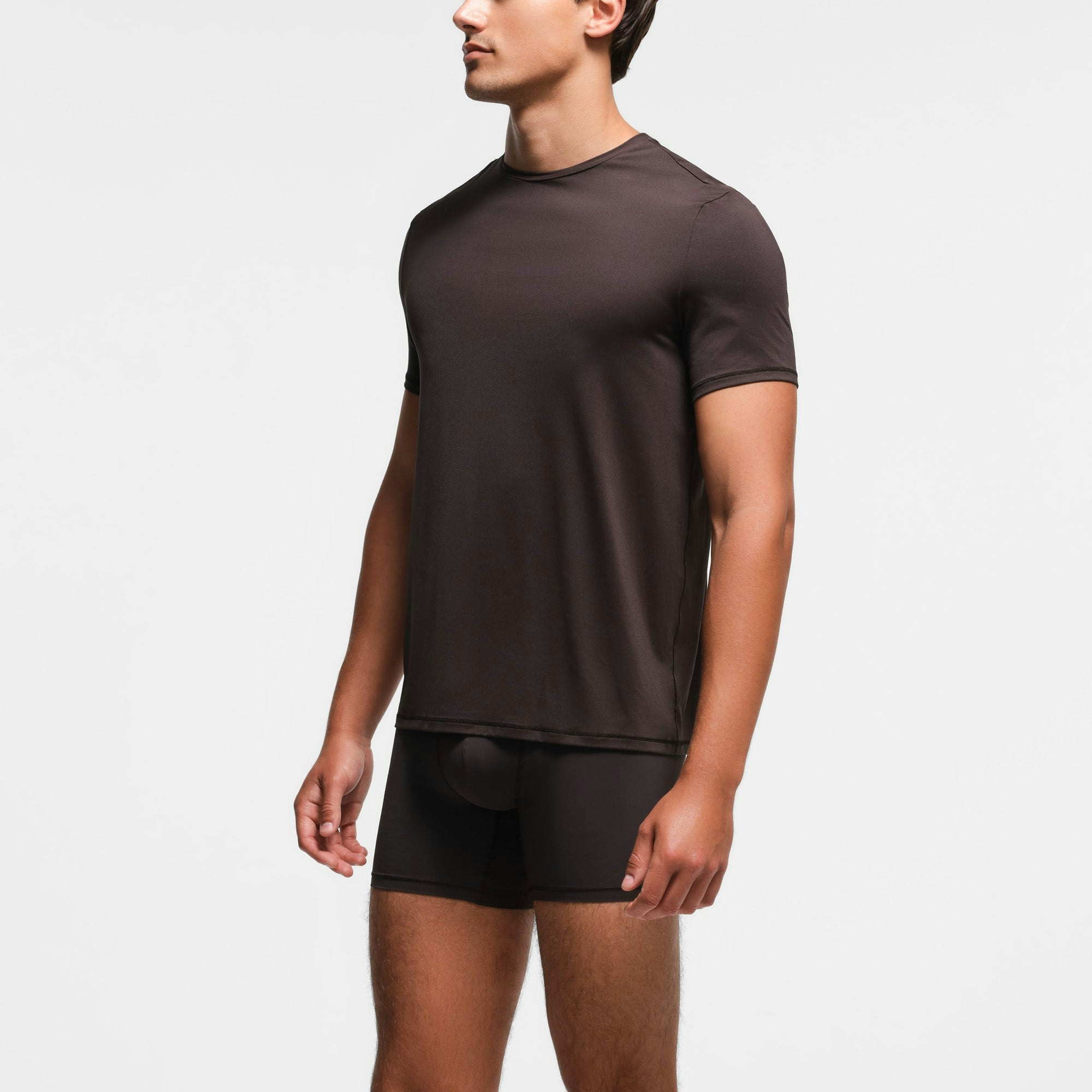 SKIMS SPORT MENS T-SHIRT | PHOENIX ON A MODEL SIDE VIEW