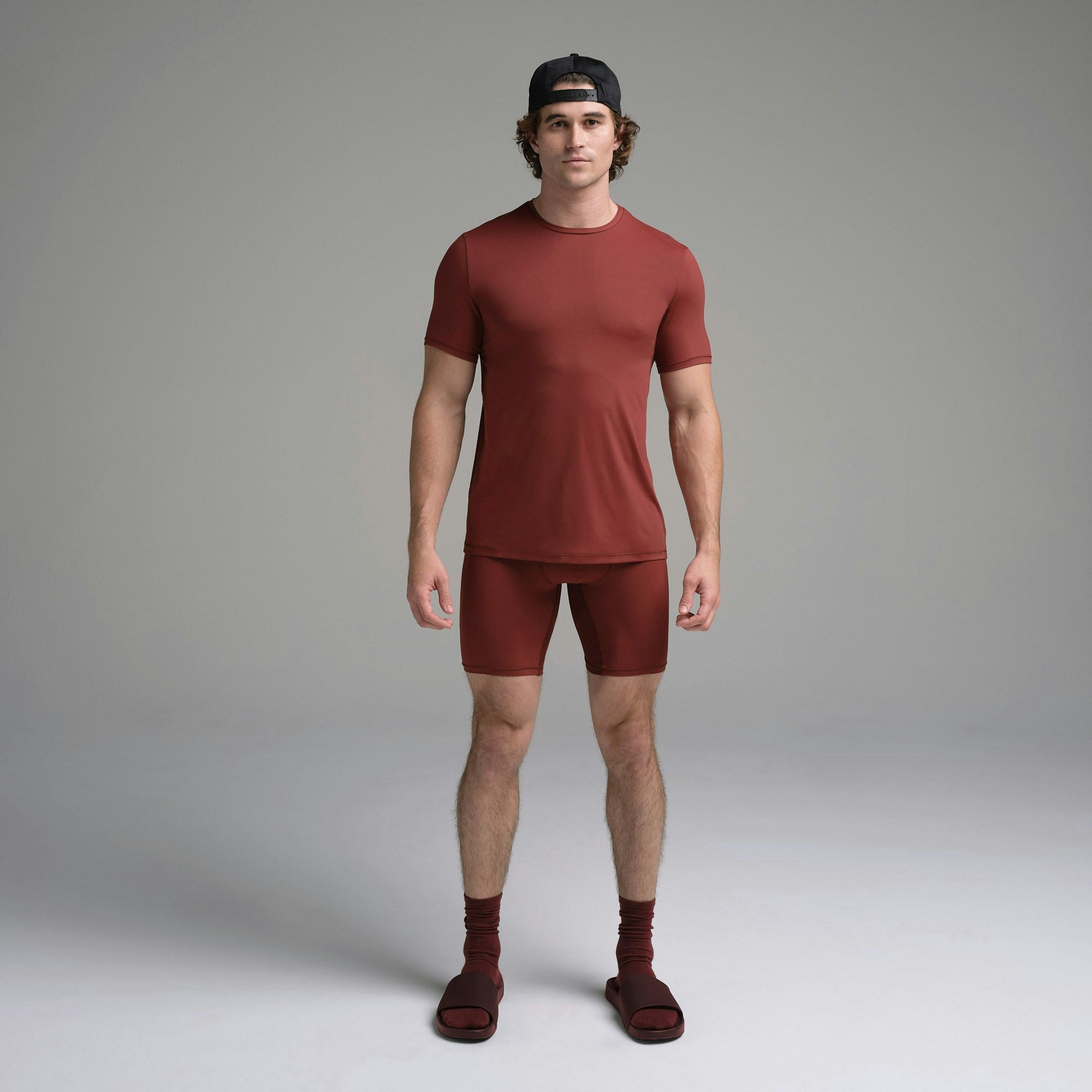 SKIMS SPORT MENS T-SHIRT | SANGRIA ON A MODEL FRONT VIEW | FOCUS: 0.0, 1.0, 0.9