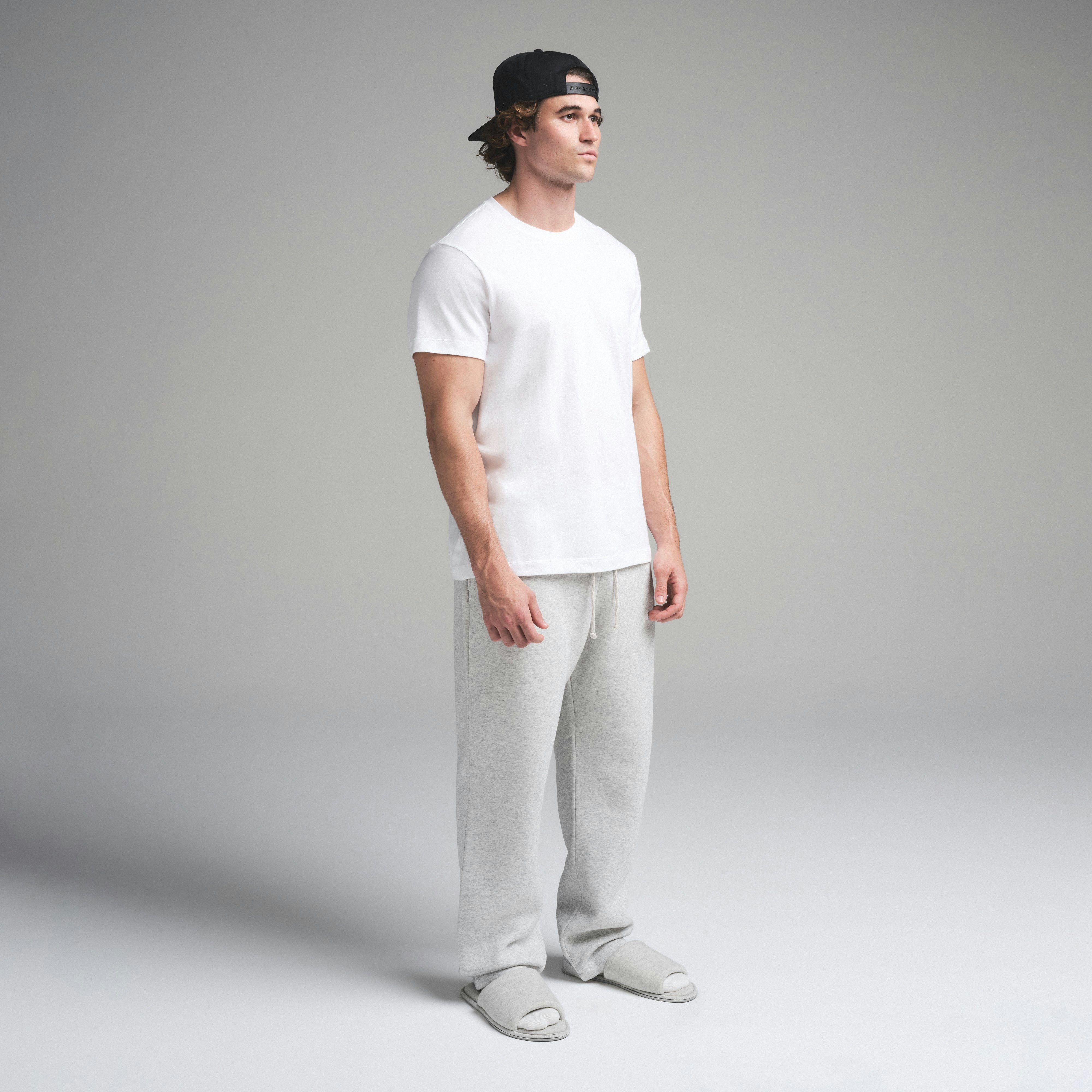 SKIMS COTTON MENS CLASSIC T-SHIRT | CHALK ON A MODEL SIDE VIEW | FOCUS: 0.0, 1.0, 0.9