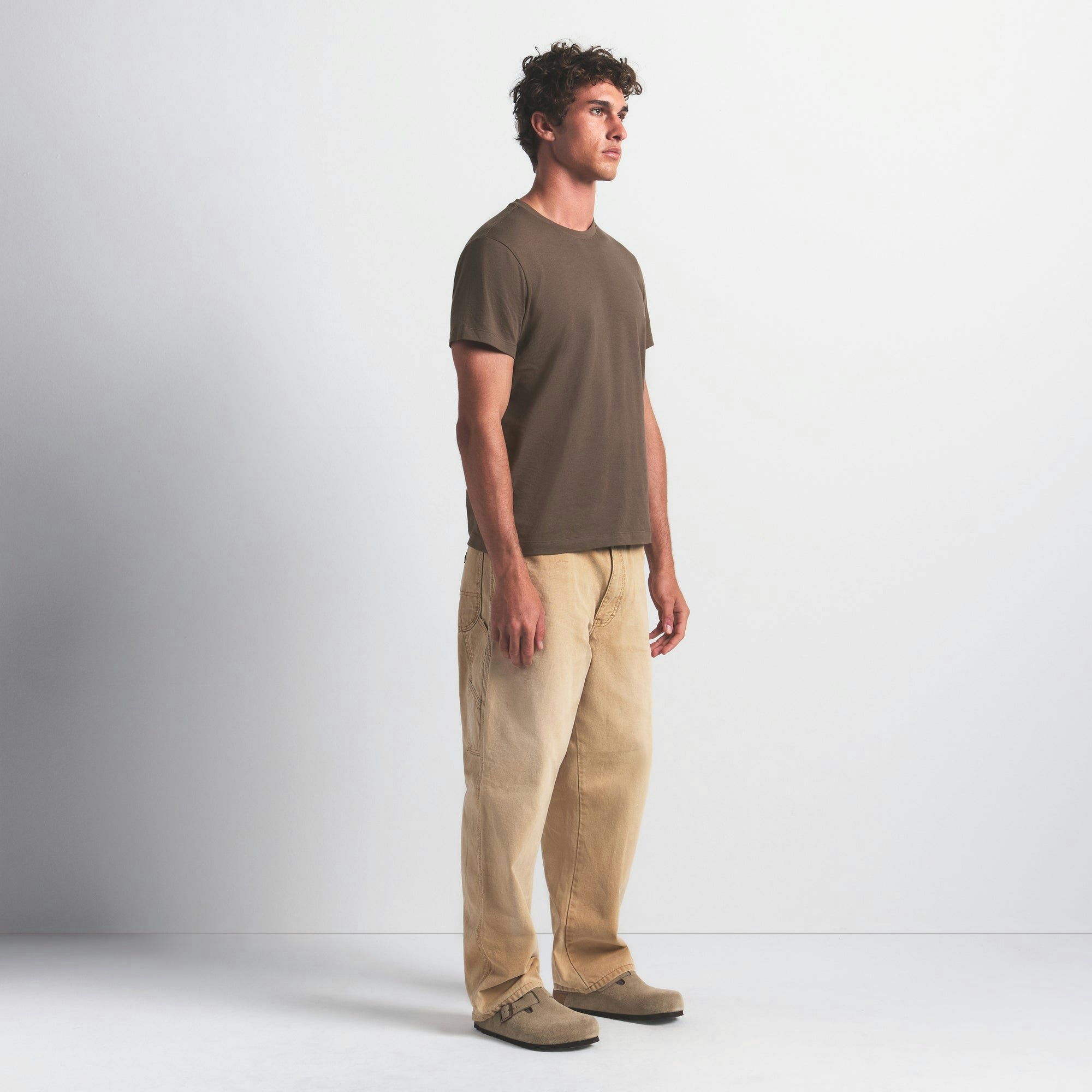 SKIMS COTTON MENS CLASSIC T-SHIRT | DRIFTWOOD ON A MODEL FRONT VIEW @ | FOCUS: 0.0, 1.0, 0.9