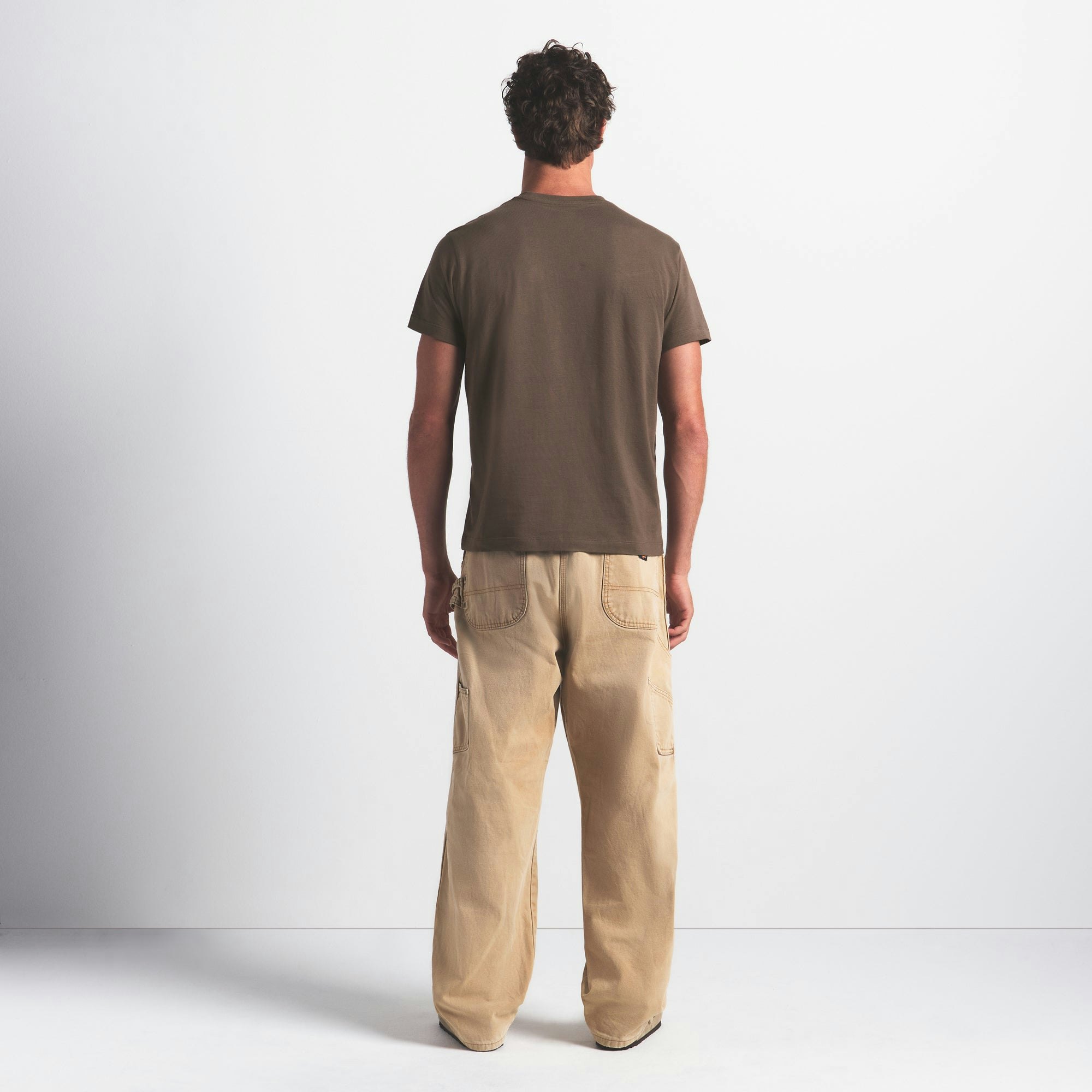 SKIMS COTTON MENS CLASSIC T-SHIRT | DRIFTWOOD ON A MODEL FRONT VIEW @ | FOCUS: 0.0, 1.0, 0.9