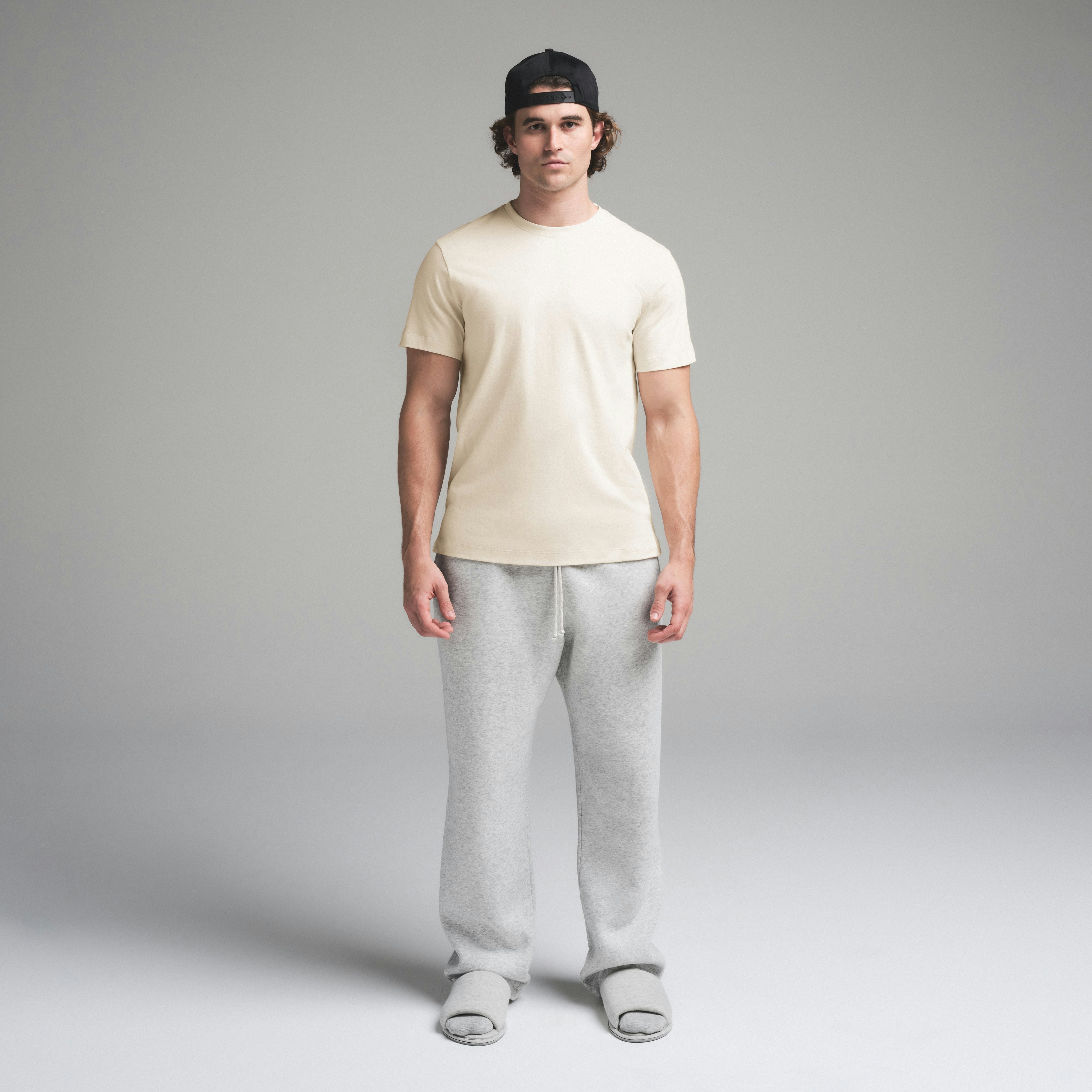 SKIMS COTTON MENS CLASSIC T-SHIRT | ECRU ON A MODEL FRONT VIEW | FOCUS: 0.0, 1.0, 0.9