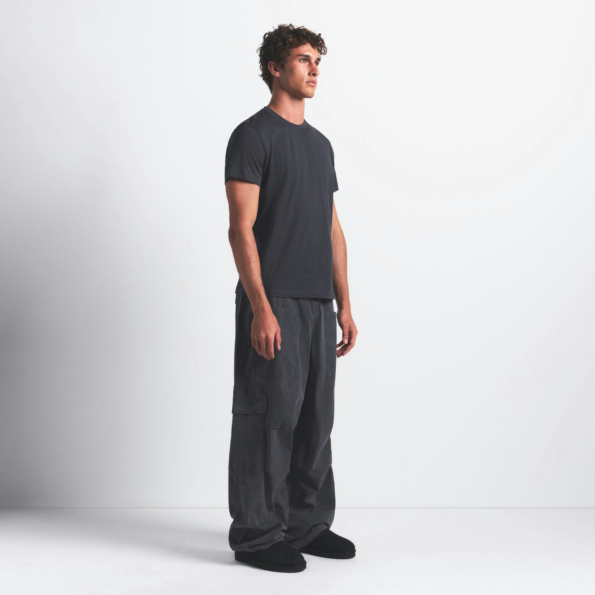 SKIMS COTTON MENS CLASSIC T-SHIRT | GRAPHITE ON A MODEL FRONT VIEW @ | FOCUS: 0.0, 1.0, 0.9