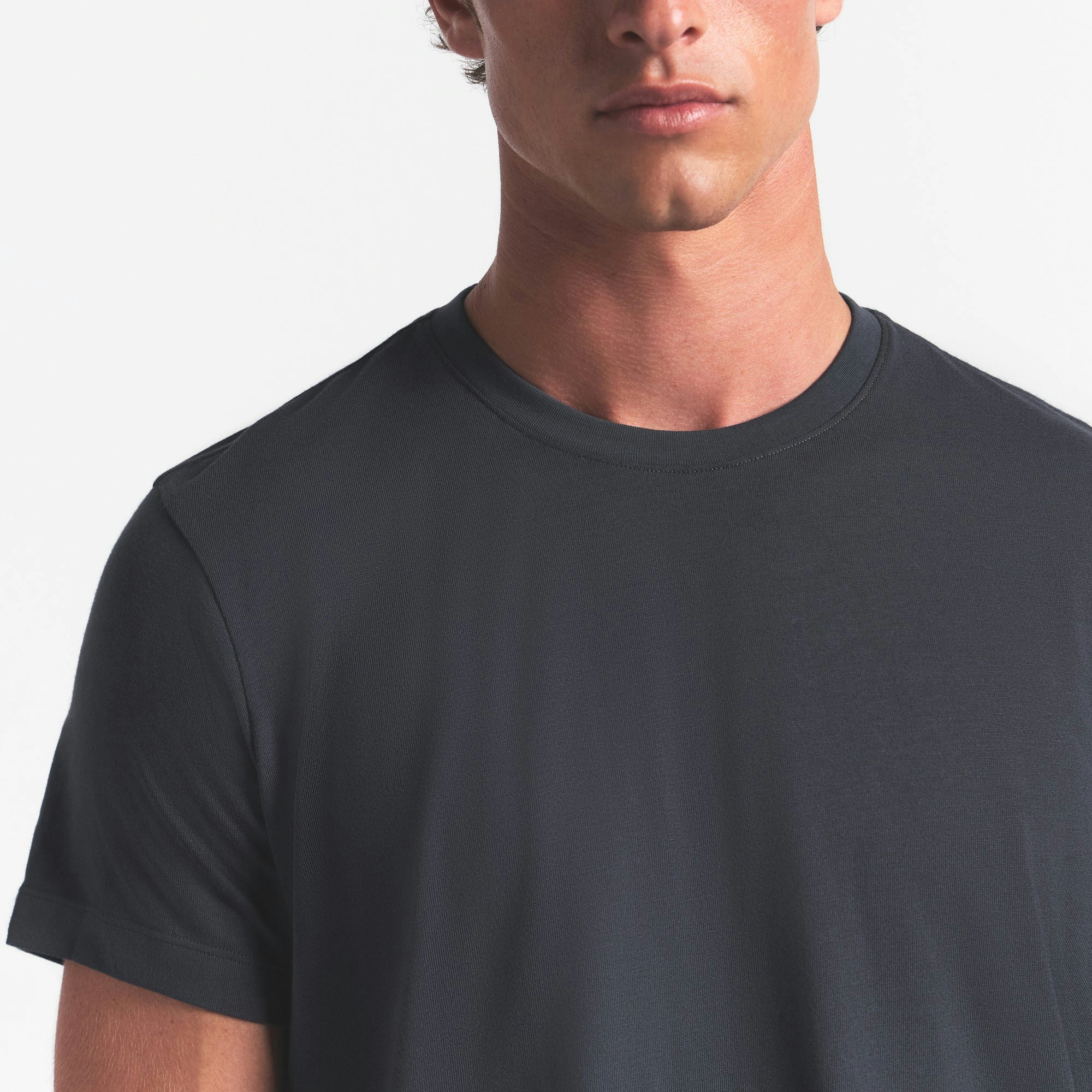 SKIMS COTTON MENS CLASSIC T-SHIRT | GRAPHITE ON A MODEL FRONT VIEW @ | FOCUS: 0.0, 1.0, 0.9