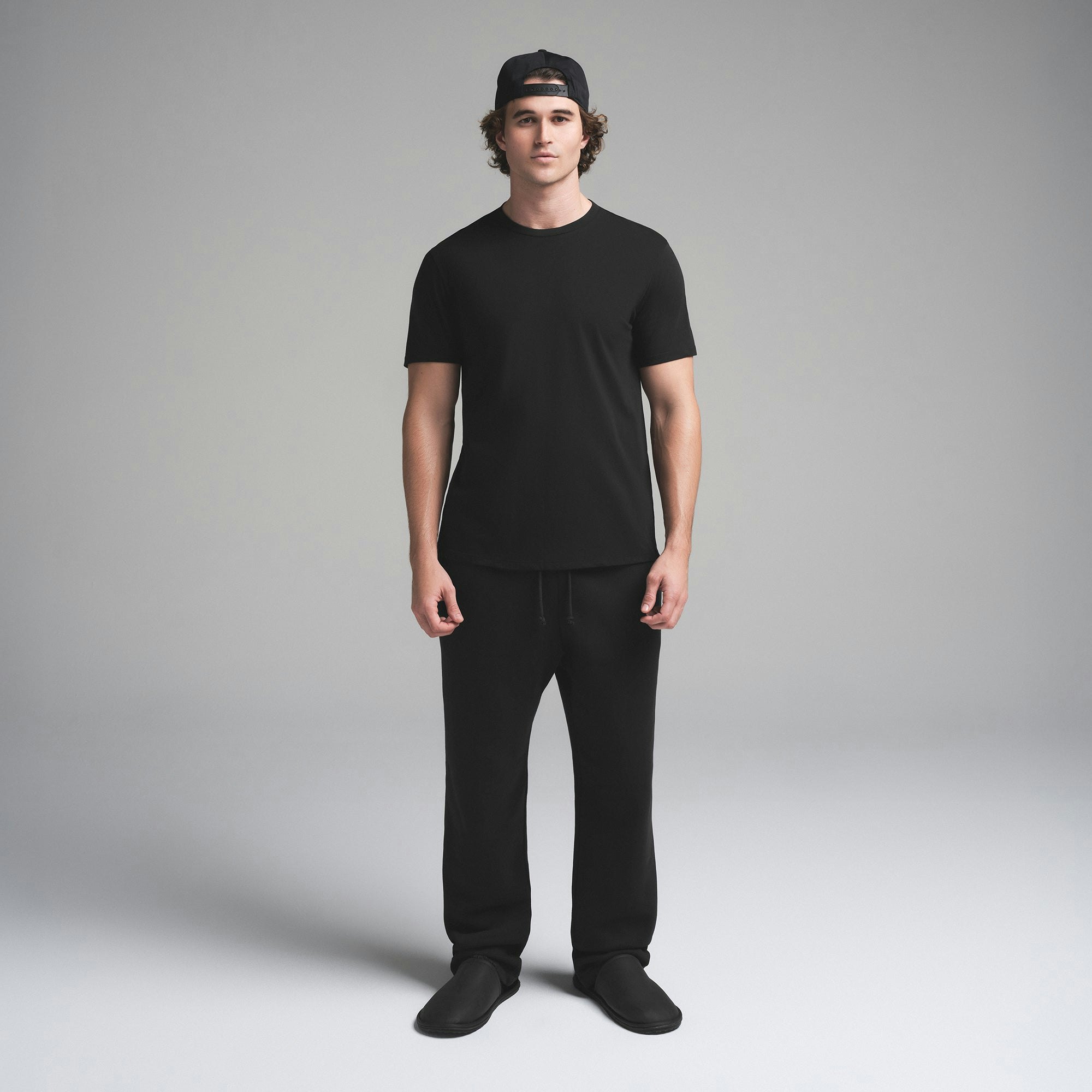 SKIMS COTTON MENS CLASSIC T-SHIRT | ONYX ON A MODEL FRONT VIEW | FOCUS: 0.0, 1.0, 0.9