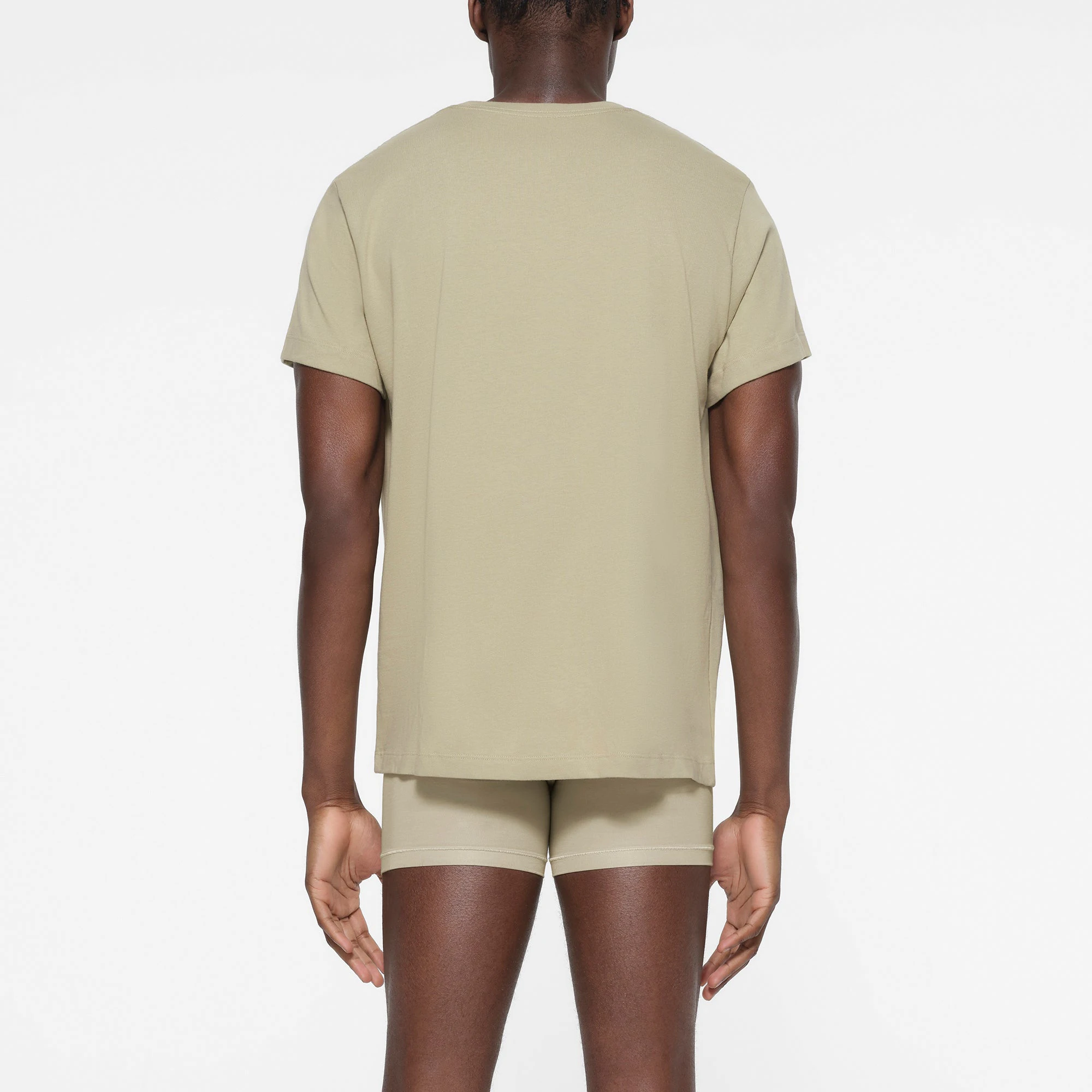 SKIMS COTTON MENS CLASSIC T-SHIRT | PHOSPHORUS ON A MODEL BACK VIEW